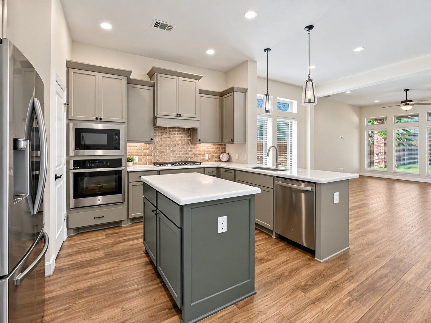 146 Dove Springs Court, Conroe, TX 77304 The kitchen is ready for everyday meals and entertaining with stainless steel appliances, 42-inch cabinets, and a large island that gives you plenty of workspace.