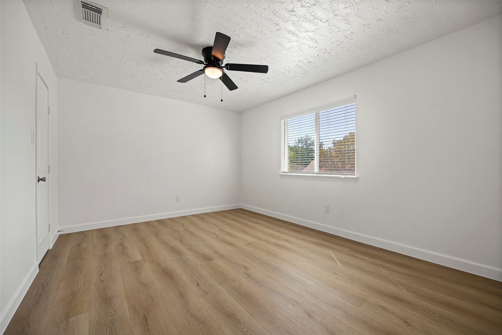 19331 Diversion Drive, Tomball, TX 77375 Spacious primary suite with new flooring and a new ceiling fan