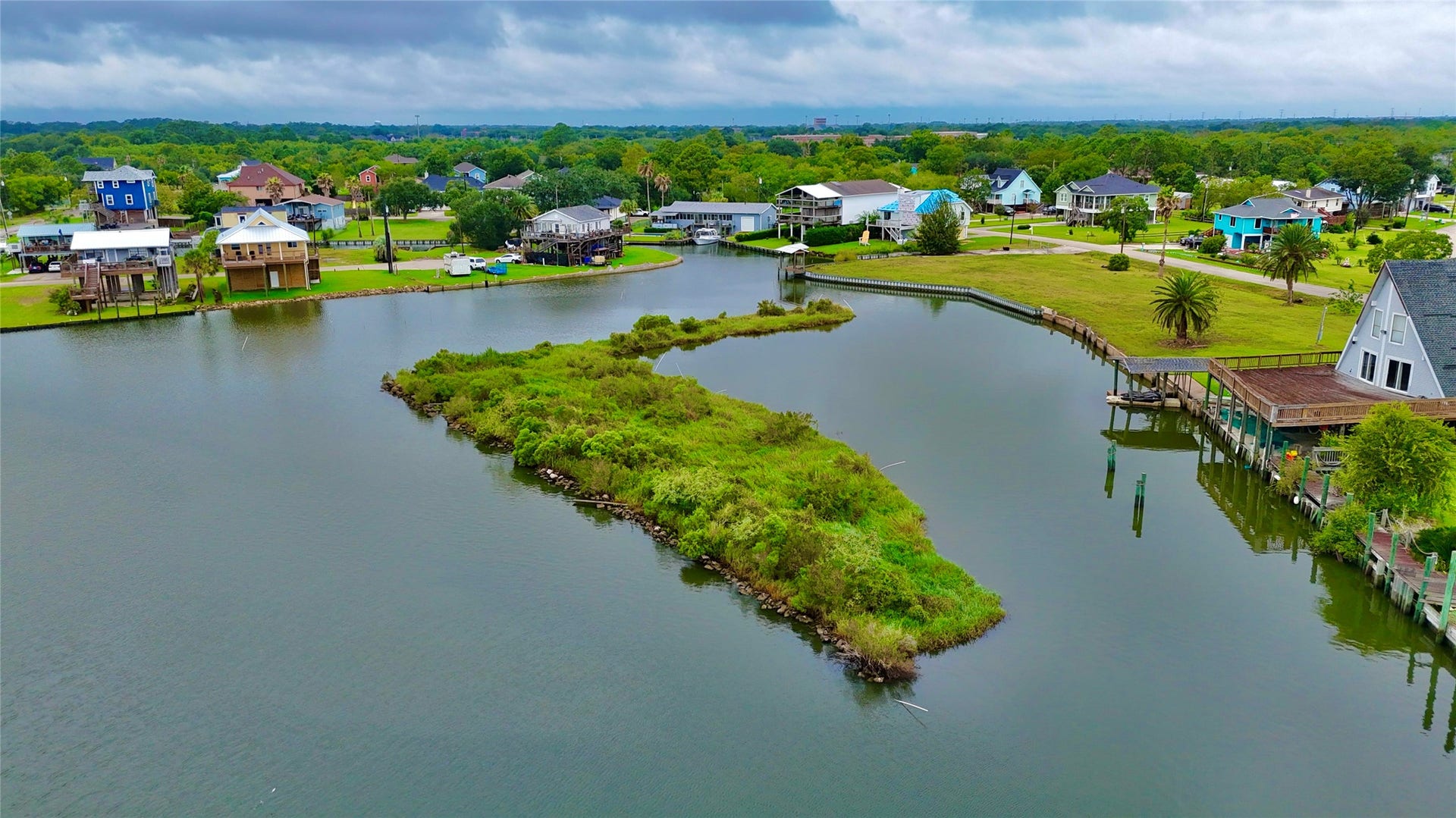 0000 Scenic Drive, Dickinson, TX 77539 Birds-eye view showcasing the local inlet, surrounding docks, and natural green island