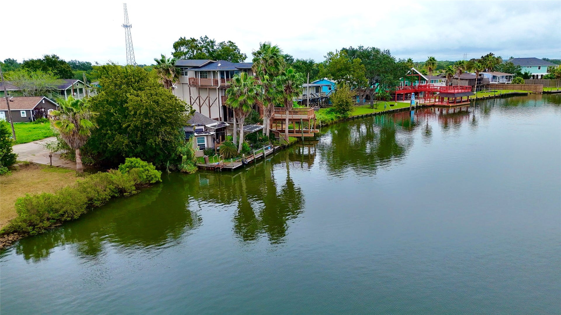 0000 Scenic Drive, Dickinson, TX 77539 Aerial view showcasing the waterfront setting, canal views, and surrounding waterfront residences.