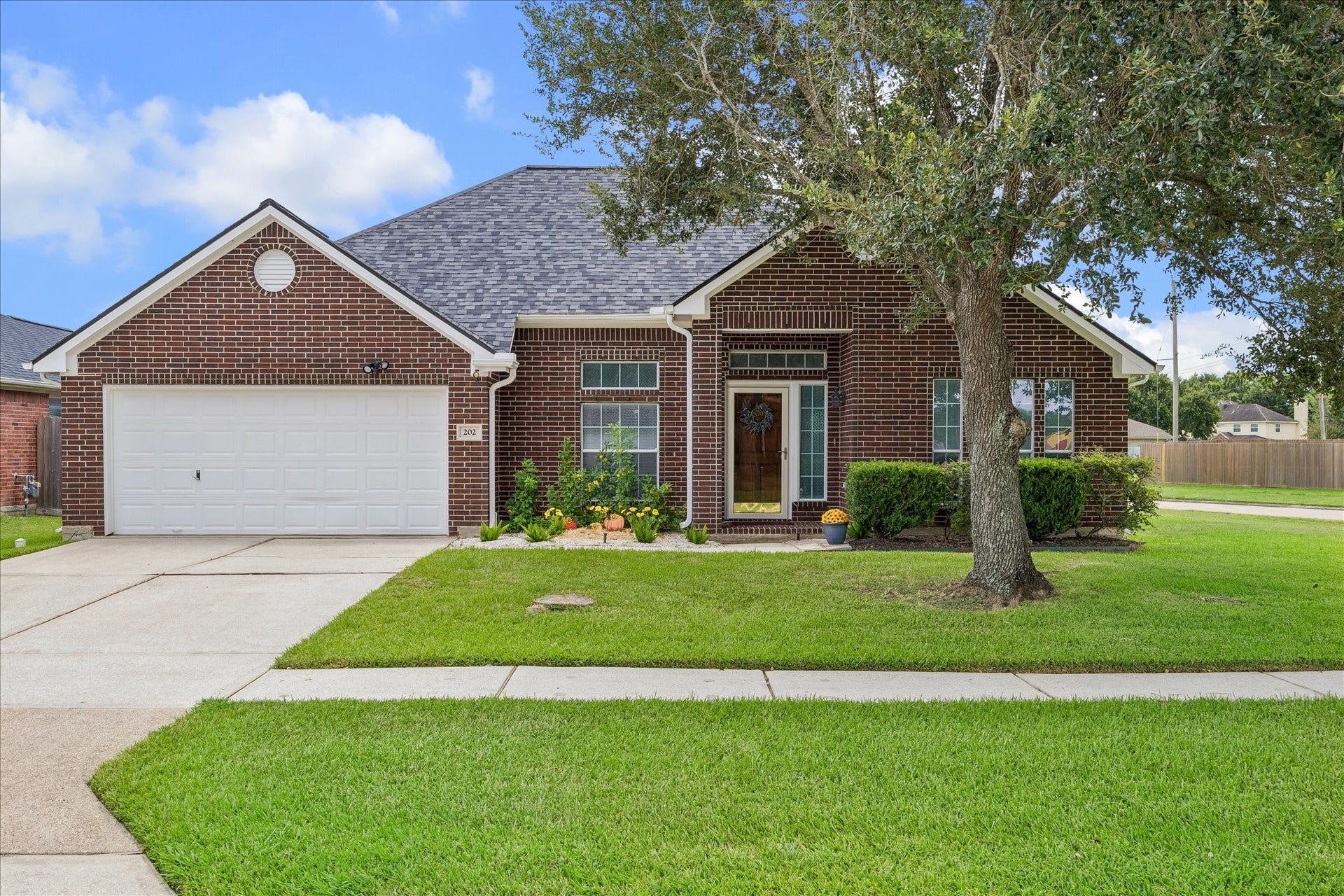 202 Meadowhill Lane, League City, TX 77539 Welcome home to 202 Meadowhill Lane! Beautiful brick exterior, lush green lawn, mature shade tree, and a charming covered entry come together to create the kind of warm, inviting curb appeal that makes you want to see whats inside. *** BONUS ~ Energy Efficient Roof ~ Gutters & High Efficiency HVAC System ~ Replaced in 2024! ***
