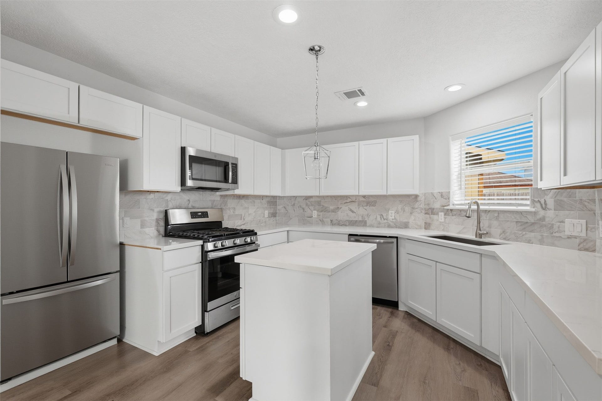 9026 Mcgallion Road, Houston, TX 77022 Virtually staged kitchen