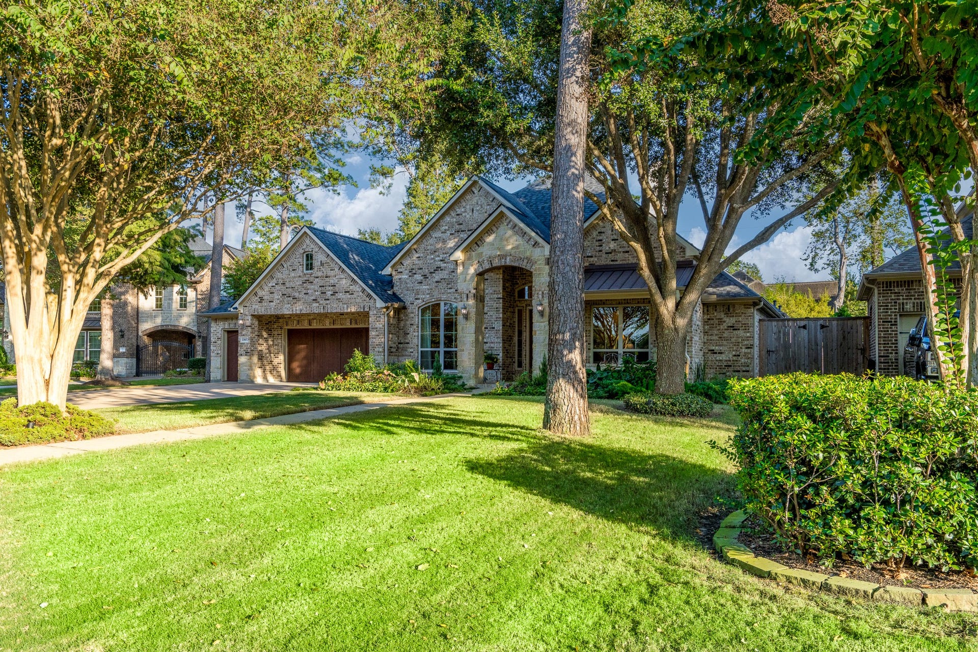 13807 Oak Fair Bend, Cypress, TX 77429 WHERE TIMELESS ELEGANCE MEETS THE BEAUTY OF NATURE! Nestled among majestic mature trees and lush, professionally landscaped grounds, this exquisite J. Patrick semi-custom home offers an enchanting sense of tranquility and privacy. Its stunning stone-and-brick architecture, sprawling green lawn, and picturesque setting create a captivating first impression in the prestigious gated community of White Oak Lake Estates. A place you'll be proud to call home!