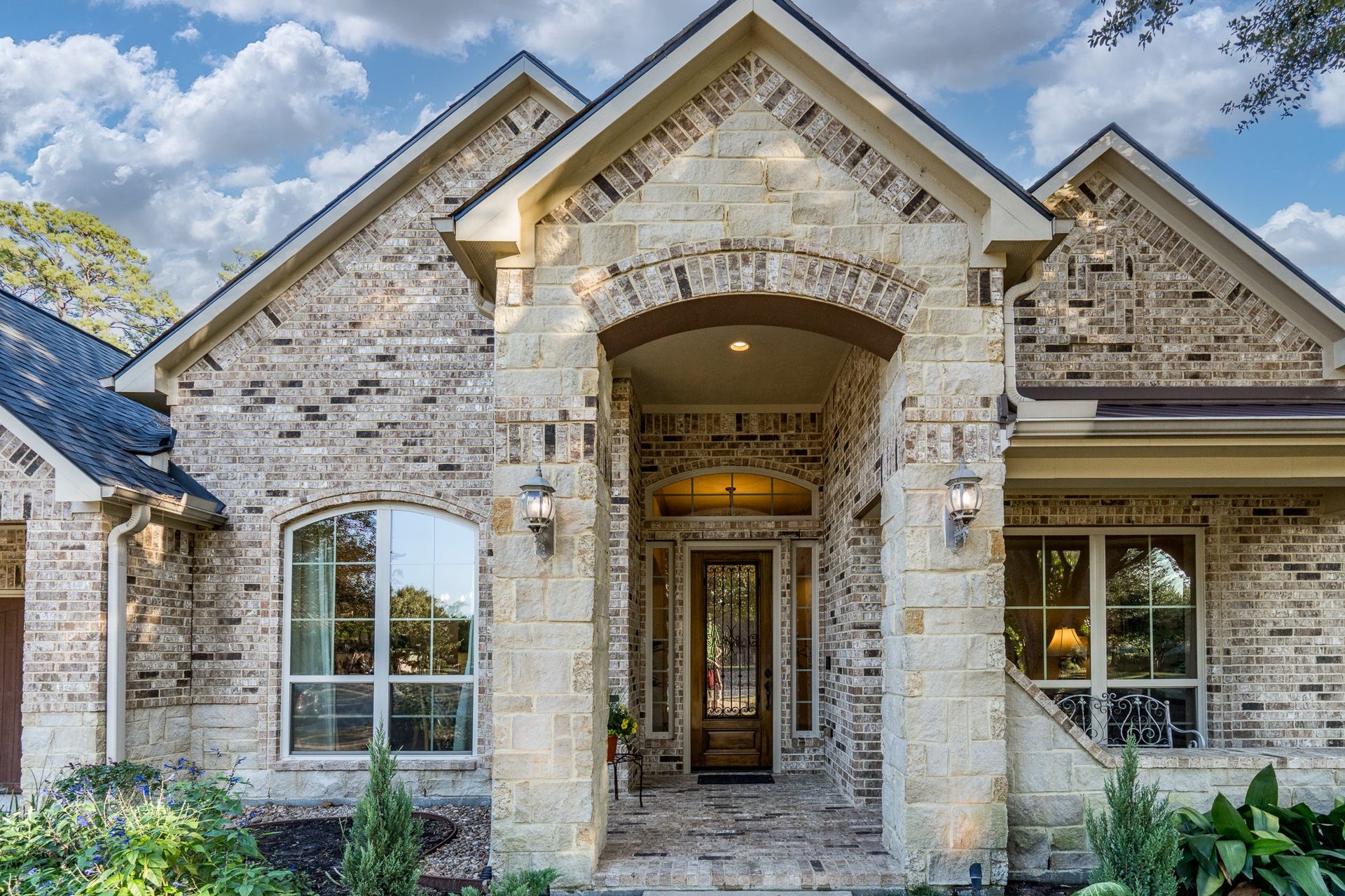 13807 Oak Fair Bend, Cypress, TX 77429 SOME HOMES CAPTURE YOUR ATTENTION THIS ONE CAPTURES YOUR HEART! From the moment you approach this exquisite J. Patrick semi-custom home, you'll be captivated by its timeless beauty and extraordinary craftsmanship. Intricate decorative brickwork, rich stone accents, and a magnificent arched entryway create a breathtaking architectural statement. Every thoughtfully designed detail offers a glimpse of the elegance, warmth, and exceptional lifestyle awaiting just beyond the front door!