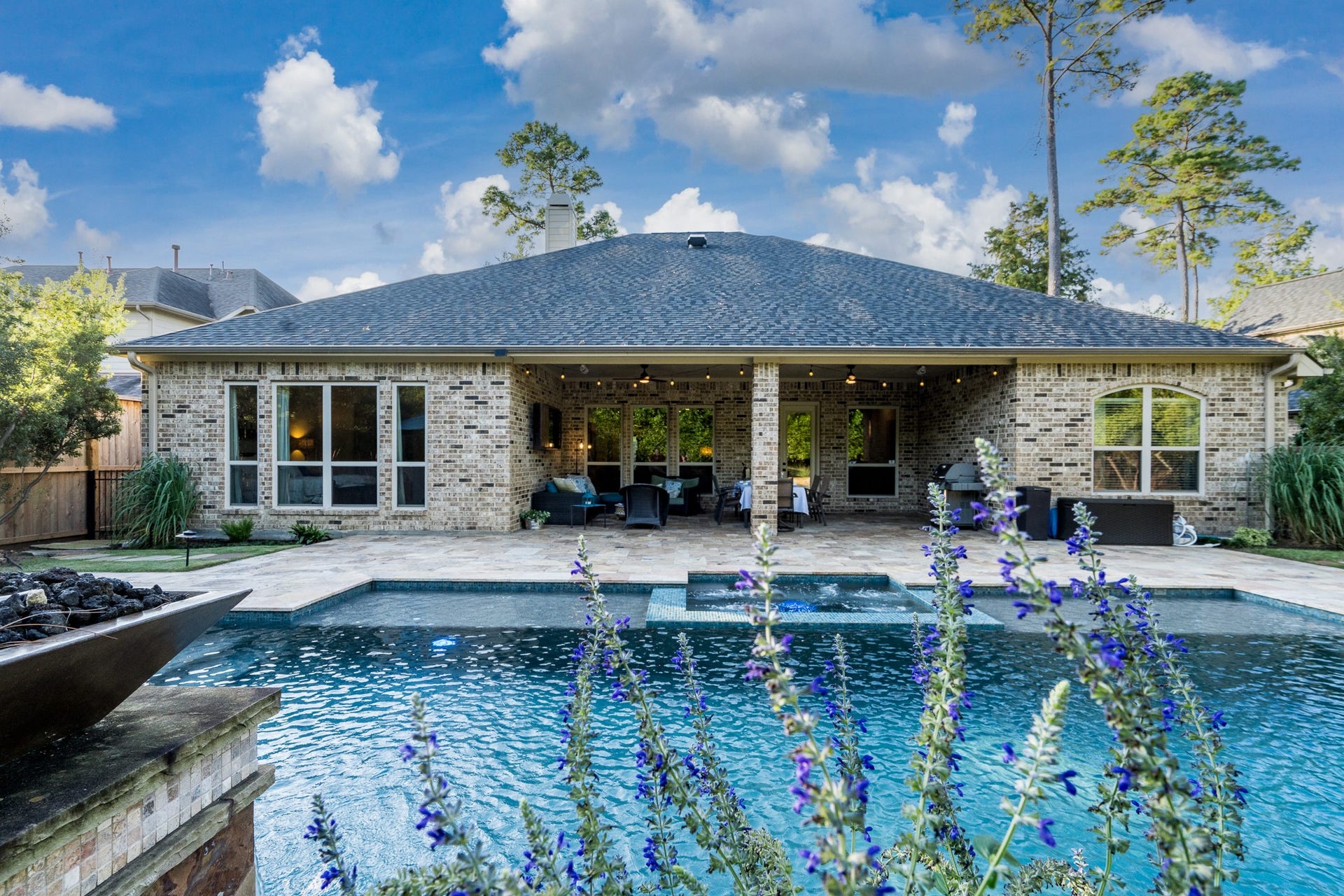 13807 Oak Fair Bend, Cypress, TX 77429 A Picture-Perfect Backyard Paradise! Peek through the colorful blooms to discover your own private resort-style oasis, featuring a sparkling swimming pool, inviting spa, and expansive covered patio designed for year-round entertaining. The recently installed roof adds lasting value and peace of mind to this exceptional luxury retreat. Every day feels like a vacation in your own backyard!