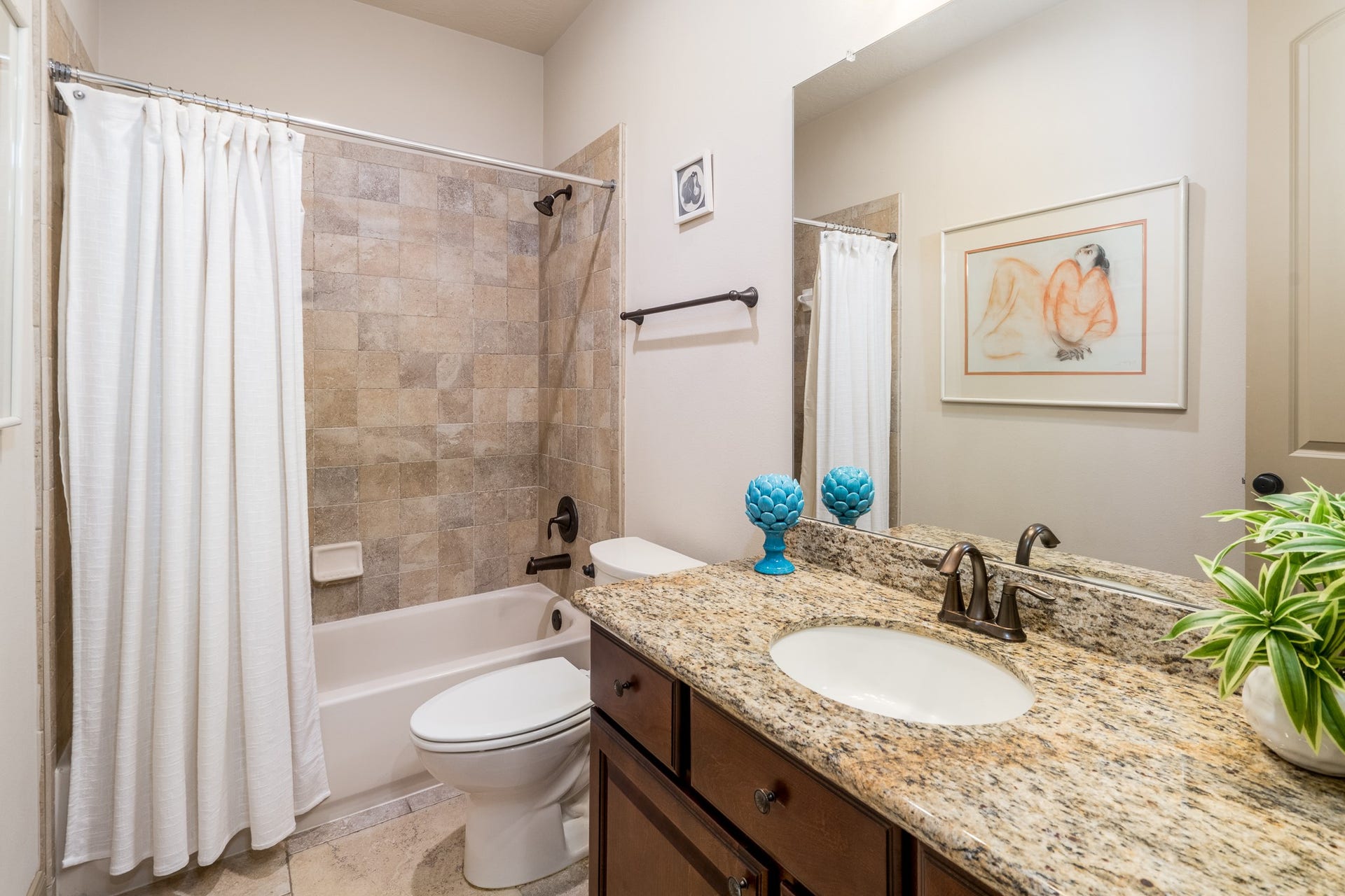 13807 Oak Fair Bend, Cypress, TX 77429 A WELCOMING TOUCH OF LUXURY FOR YOUR GUESTS! Beautifully appointed with elegant granite countertops, rich cabinetry, and timeless tile finishes, this inviting guest bathroom blends sophistication with everyday comfort. A spacious vanity and relaxing tub-and-shower combination create a thoughtfully designed retreat where guests can feel pampered and right at home!
