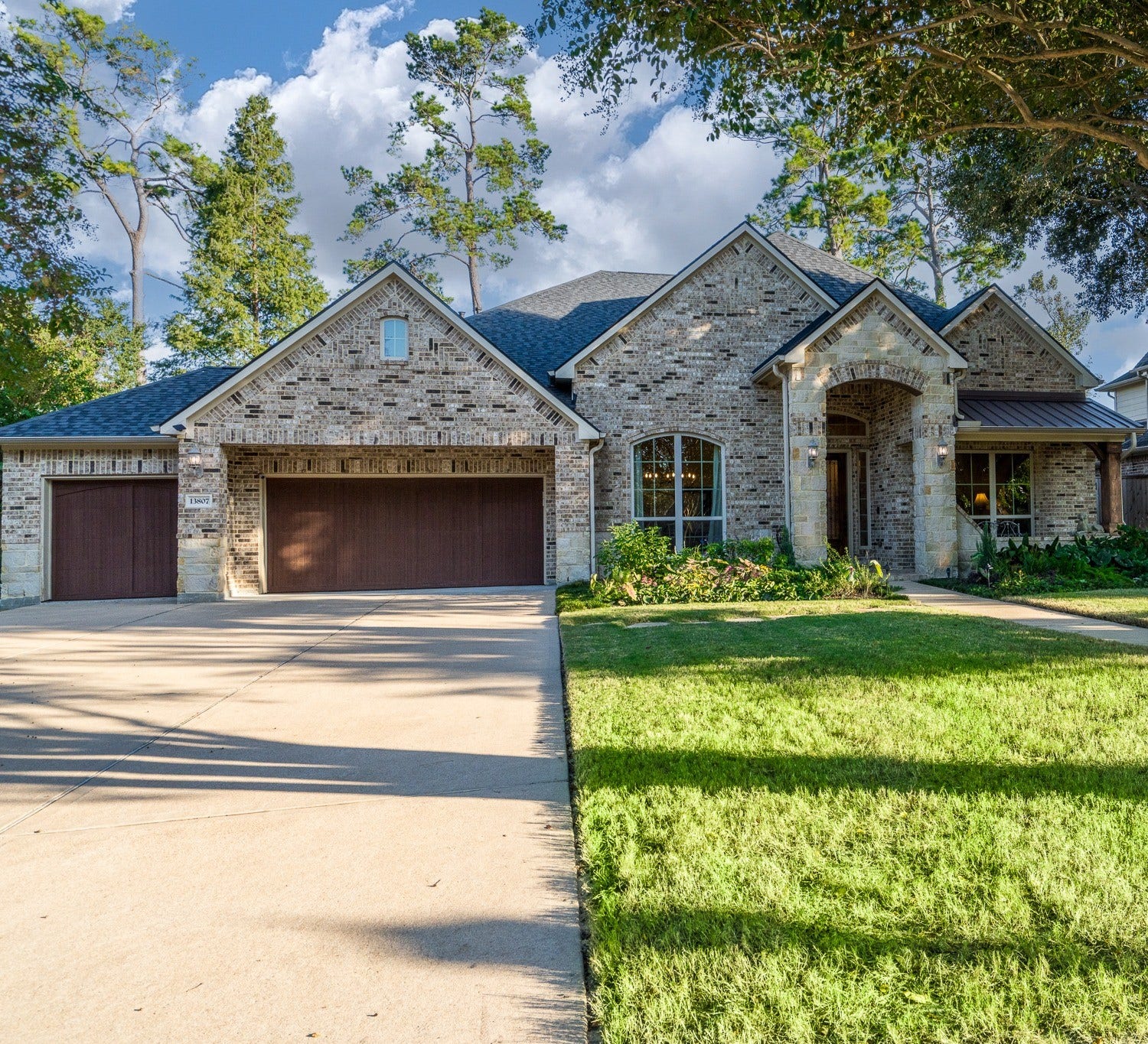 13807 Oak Fair Bend, Cypress, TX 77429 Notice the gorgeous architectural detail of the intricate brickwork on this semi custom J. Patrick one story and the mature professional landscaping. This home has a covered front porch too!