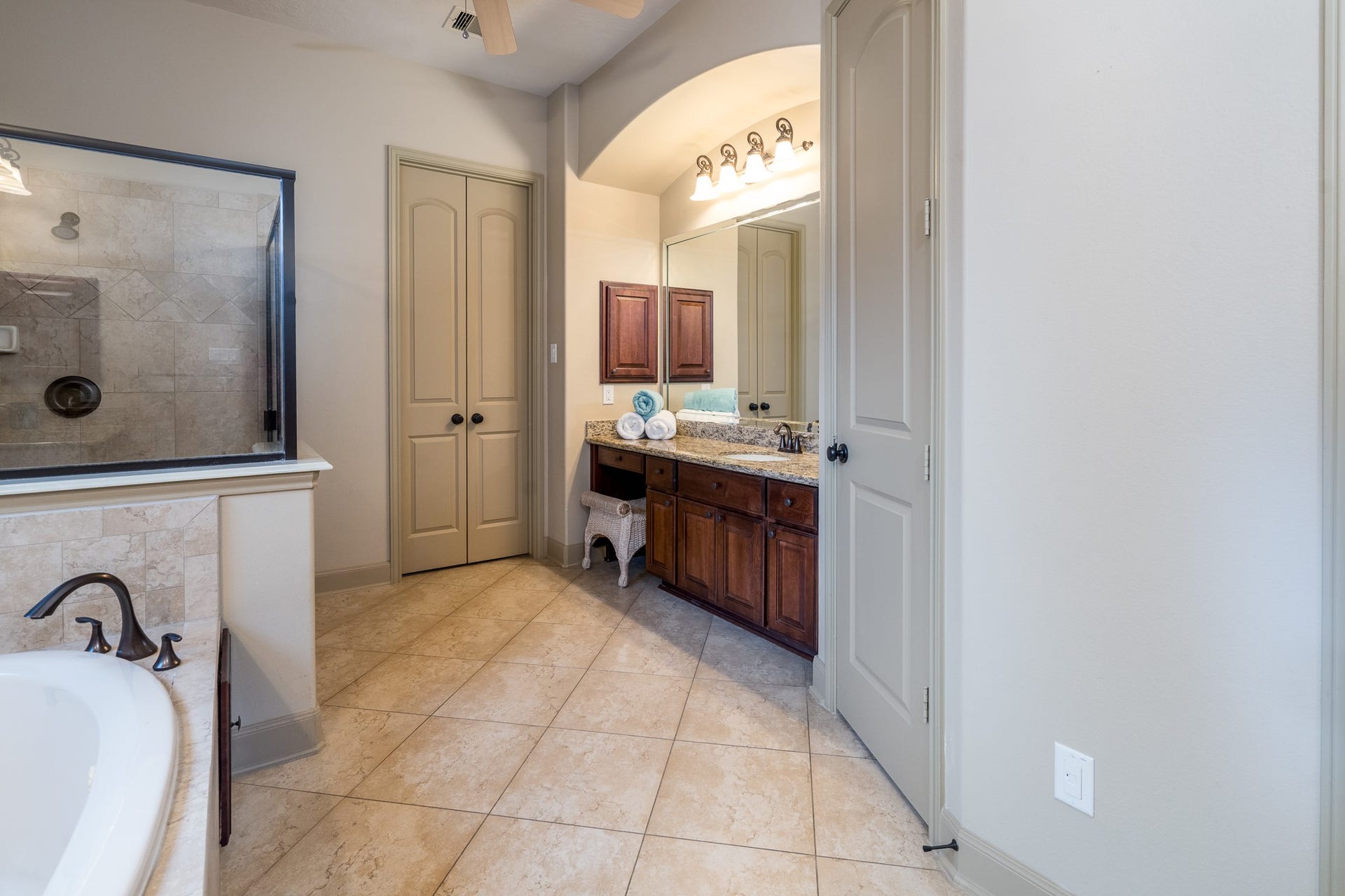 13807 Oak Fair Bend, Cypress, TX 77429 A LITTLE LUXURY, A LOT OF SERENITY! Imagine beginning your mornings feeling refreshed and ending your evenings in complete relaxation. This beautifully appointed primary ensuite offers the perfect escape, featuring elegant granite vanities, a spacious glass-enclosed shower, a luxurious soaking tub, and timeless natural stone finishes. Thoughtfully designed for comfort and indulgence, this spa-inspired retreat transforms everyday routines into moments of pure relaxation!