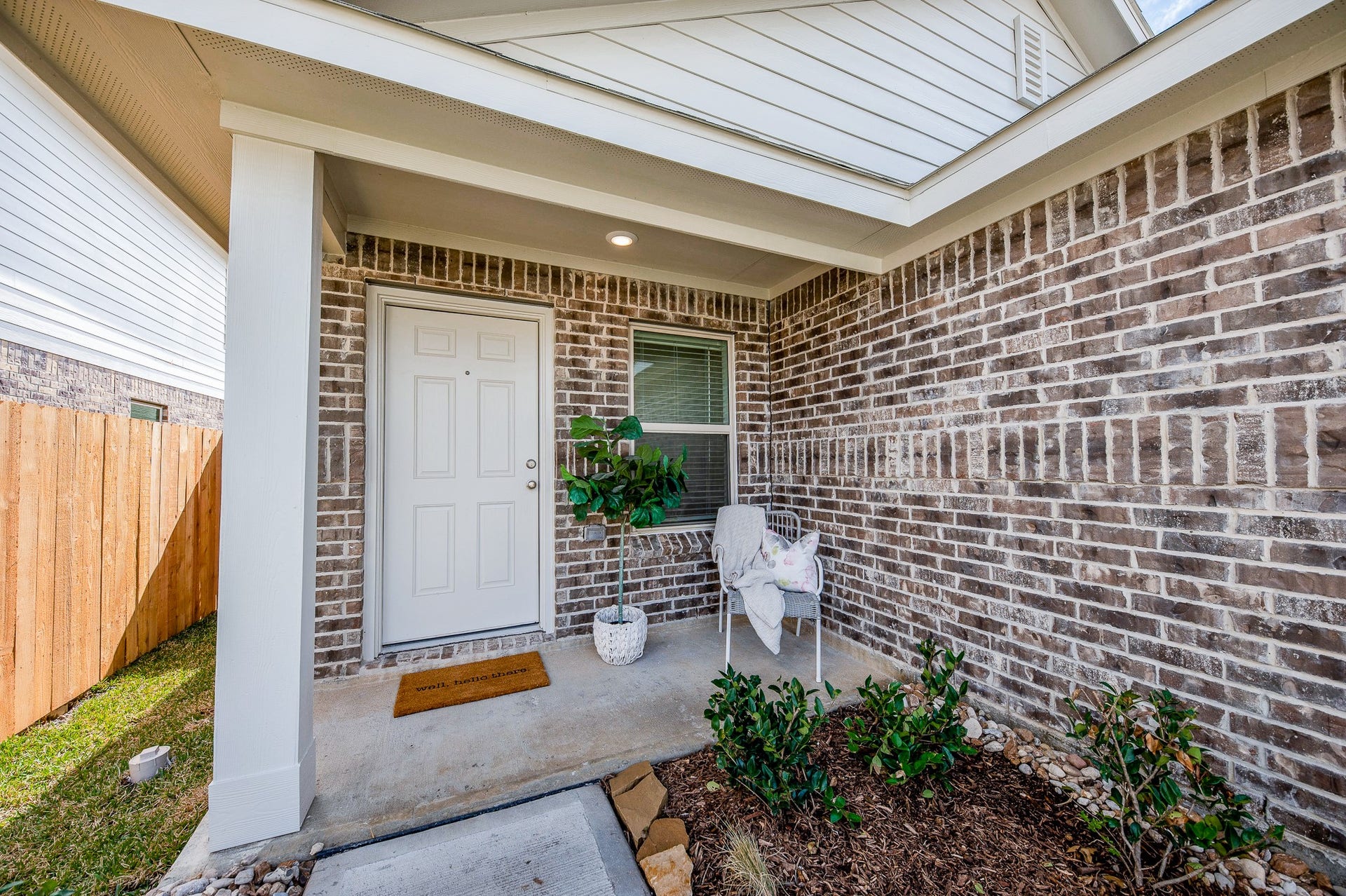 A sweet, covered porch to enjoy your morning cup of coffee and to collect your Amazon packages!