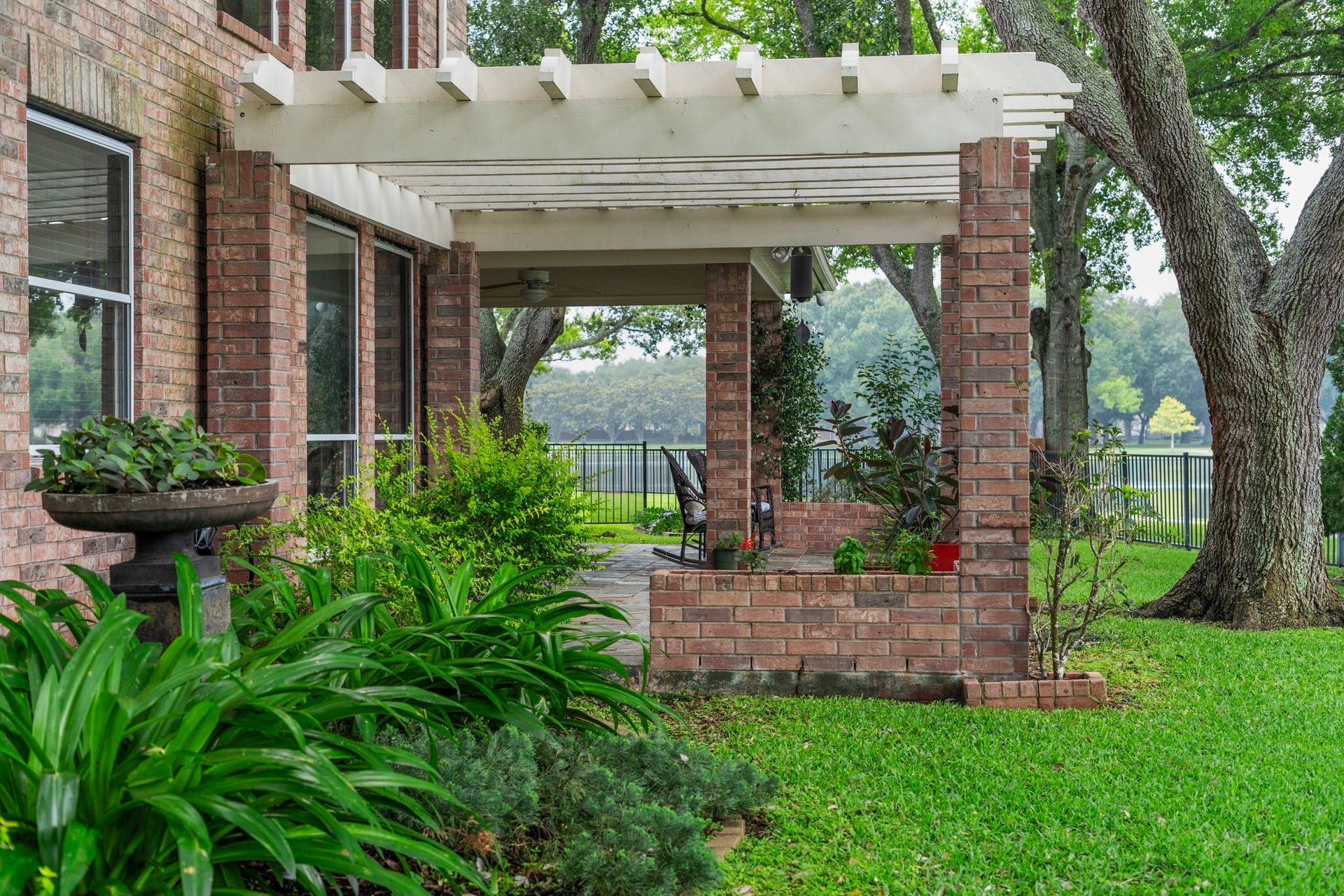 39 Rippling Creek Drive, Sugar Land, TX 77479 A pergola over the patio adds charm and definition to the outdoor living space.