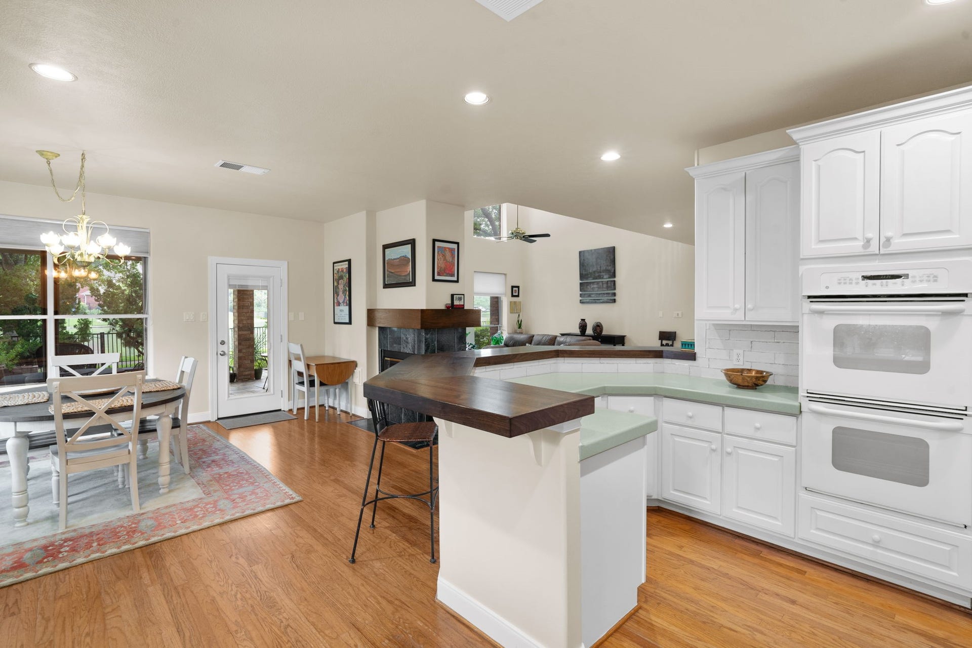 39 Rippling Creek Drive, Sugar Land, TX 77479 A beautiful walnut breakfast bar counter and fireplace mantel were recently installed, adding warmth and character to the space.