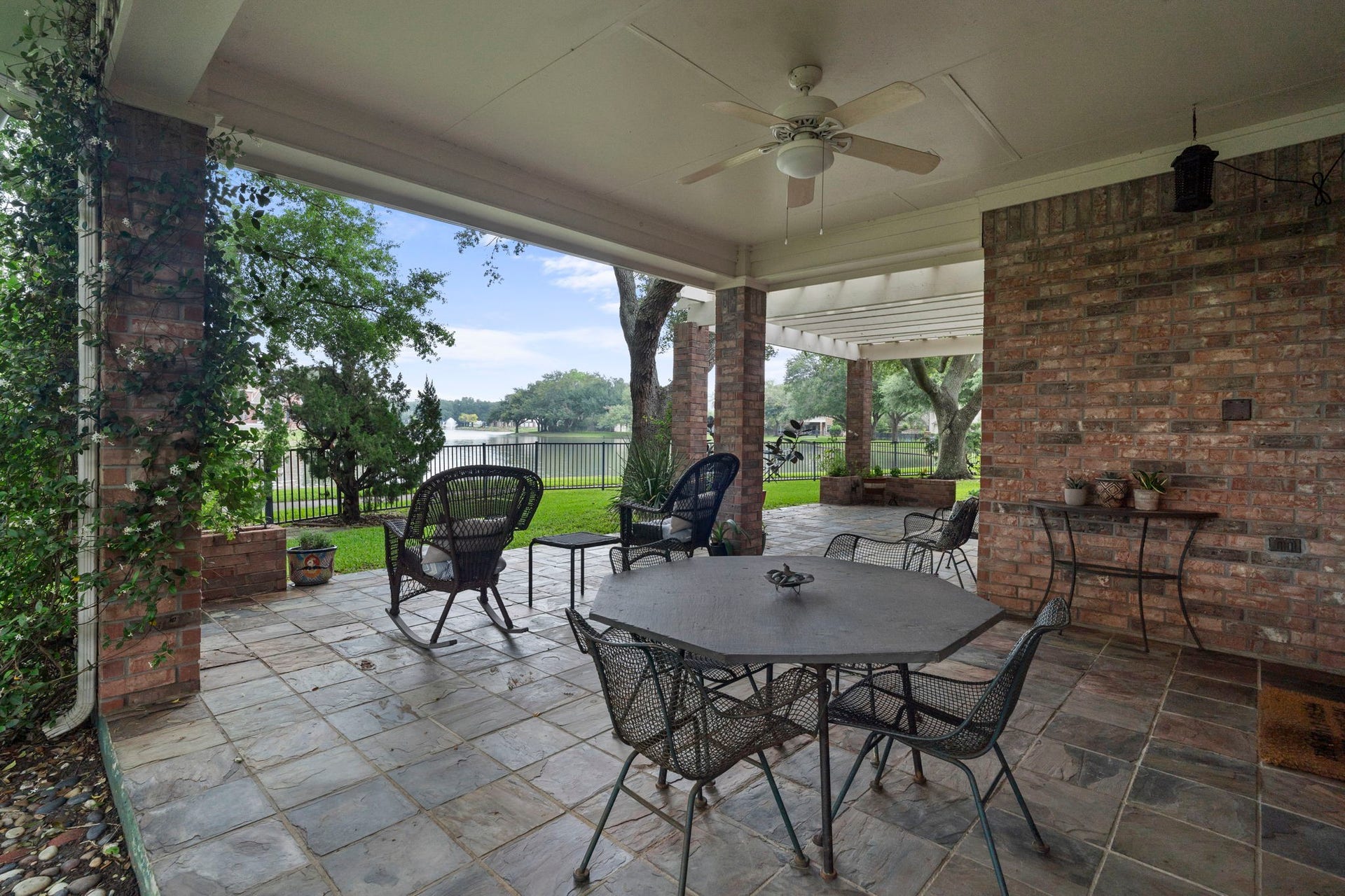 39 Rippling Creek Drive, Sugar Land, TX 77479 Pull up a chair and relax on the covered flagstone patio.