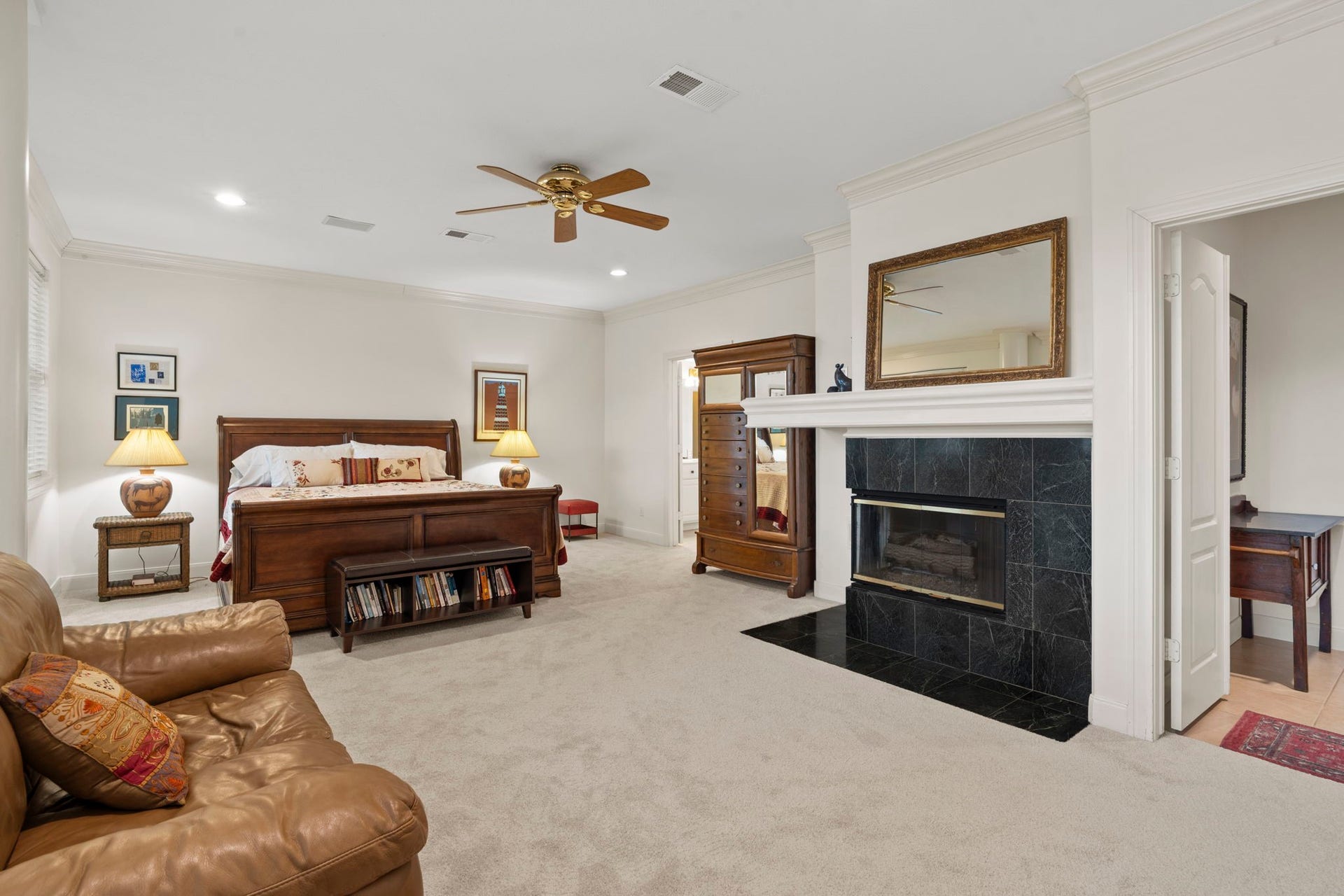 39 Rippling Creek Drive, Sugar Land, TX 77479 The primary suite offers a private retreat with a sitting area and its own fireplace.