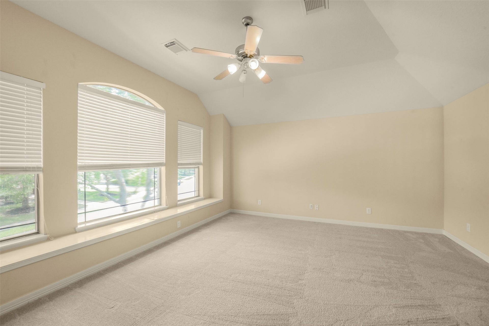 21603 Statfield Glen, Katy, TX 77450 The study/living room features gambrel ceilings and a lighted ceiling fan.