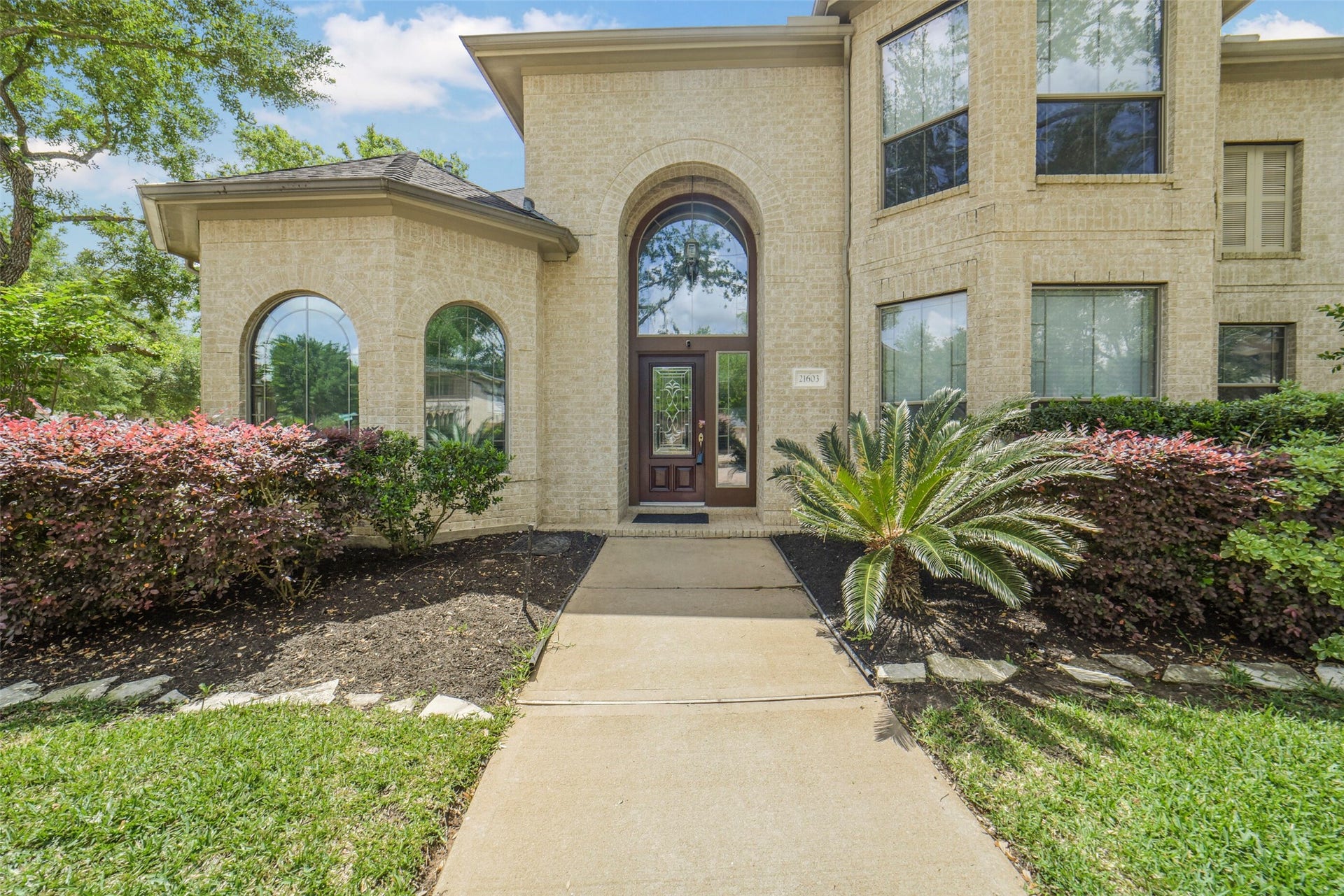 21603 Statfield Glen, Katy, TX 77450 This four-sided brick home features an arched brick porch with a rounded ceiling. A solid wood front door with beveled glass welcomes you inside.