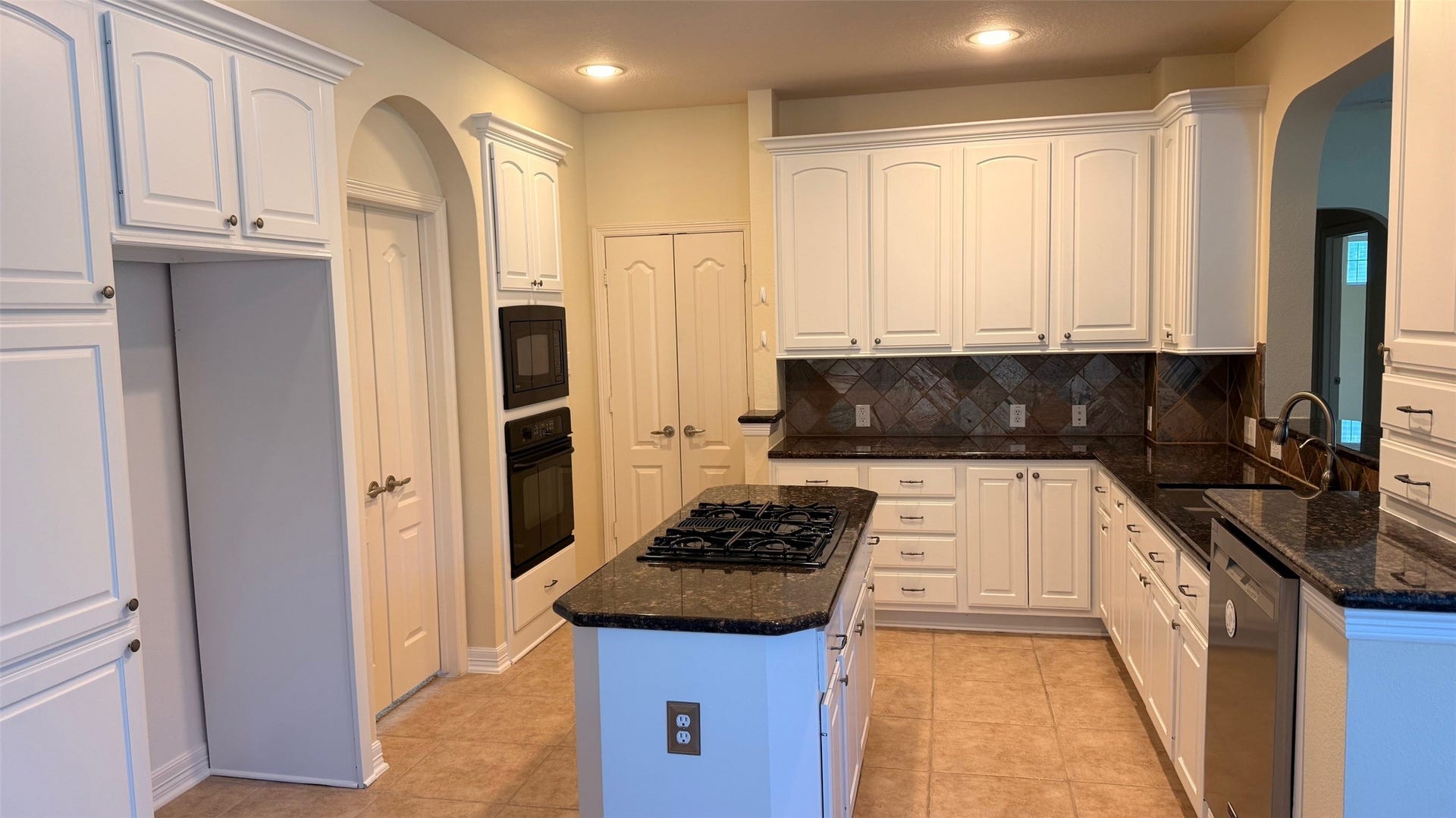 21603 Statfield Glen, Katy, TX 77450 Elegant ceramic tile flooring, two sets of French doors, and a suite of built-in appliances.