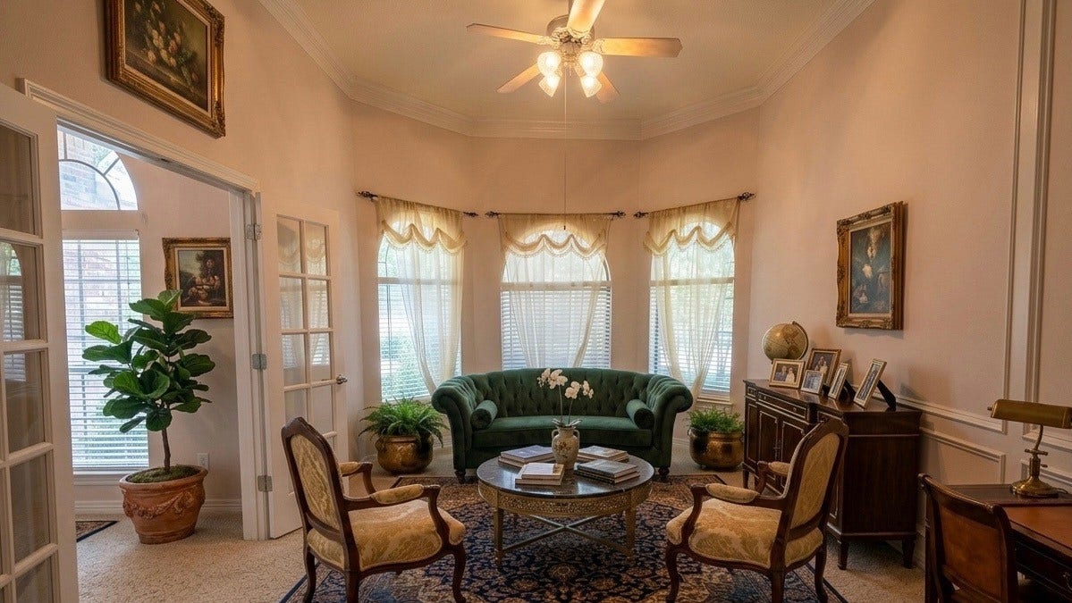 21603 Statfield Glen, Katy, TX 77450 The formal dining room sits just off the foyer, seamlessly connected to the kitchen. It features elegant bay windows, French doors, and intricate crown, chair, and picture frame molding, all complemented by a ceiling fan with a light fixture.