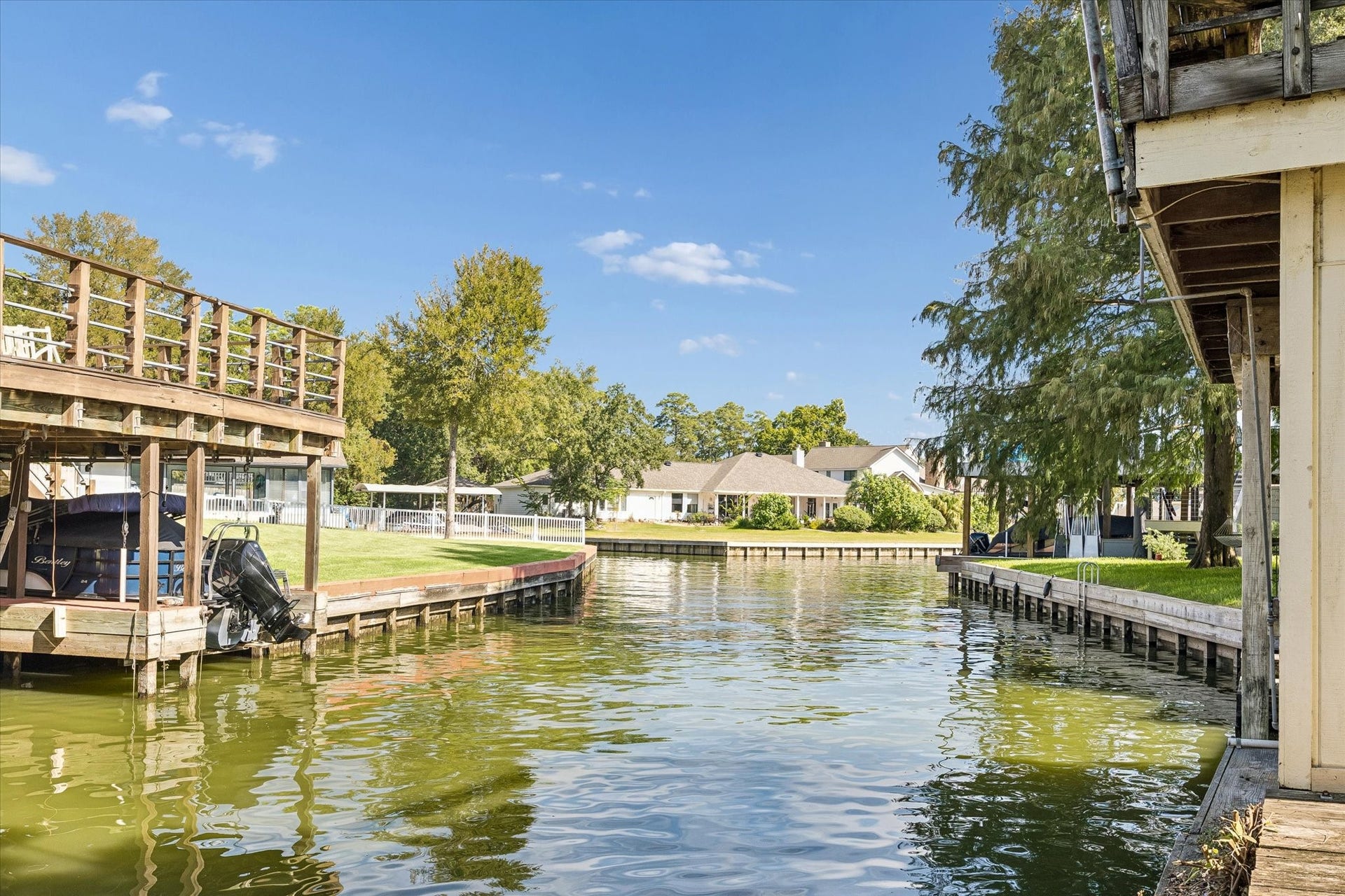Lake Conroe views from the end of the boathouse showcase the peaceful waterfront setting and the Lake Conroe lifestyle that makes this April Sound property so special.