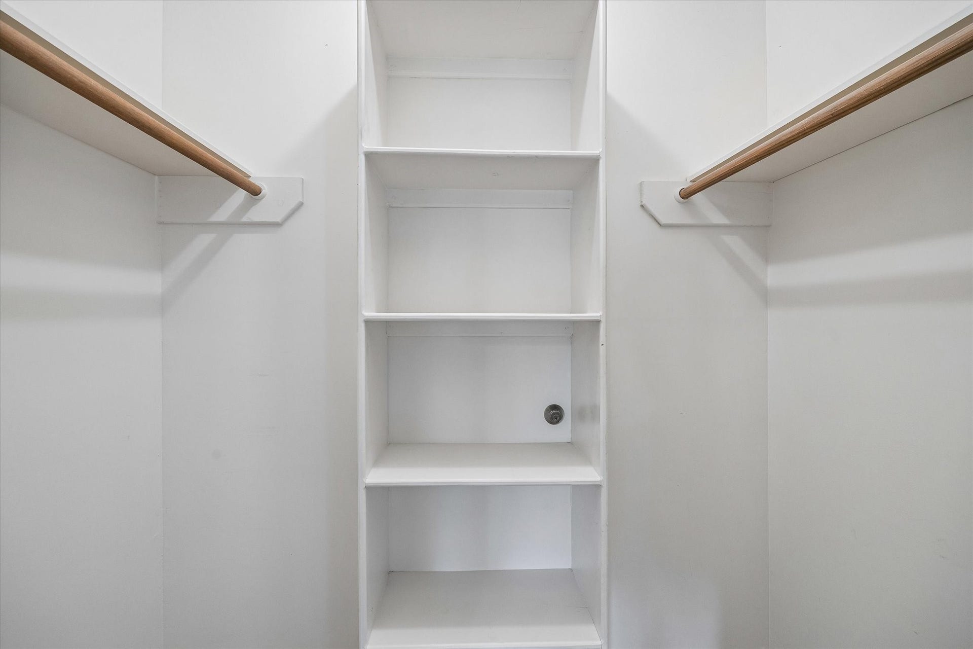 What looks like a small shelved closet holds a surprise...a concealed doorway leads to a hidden bonus/storage room.