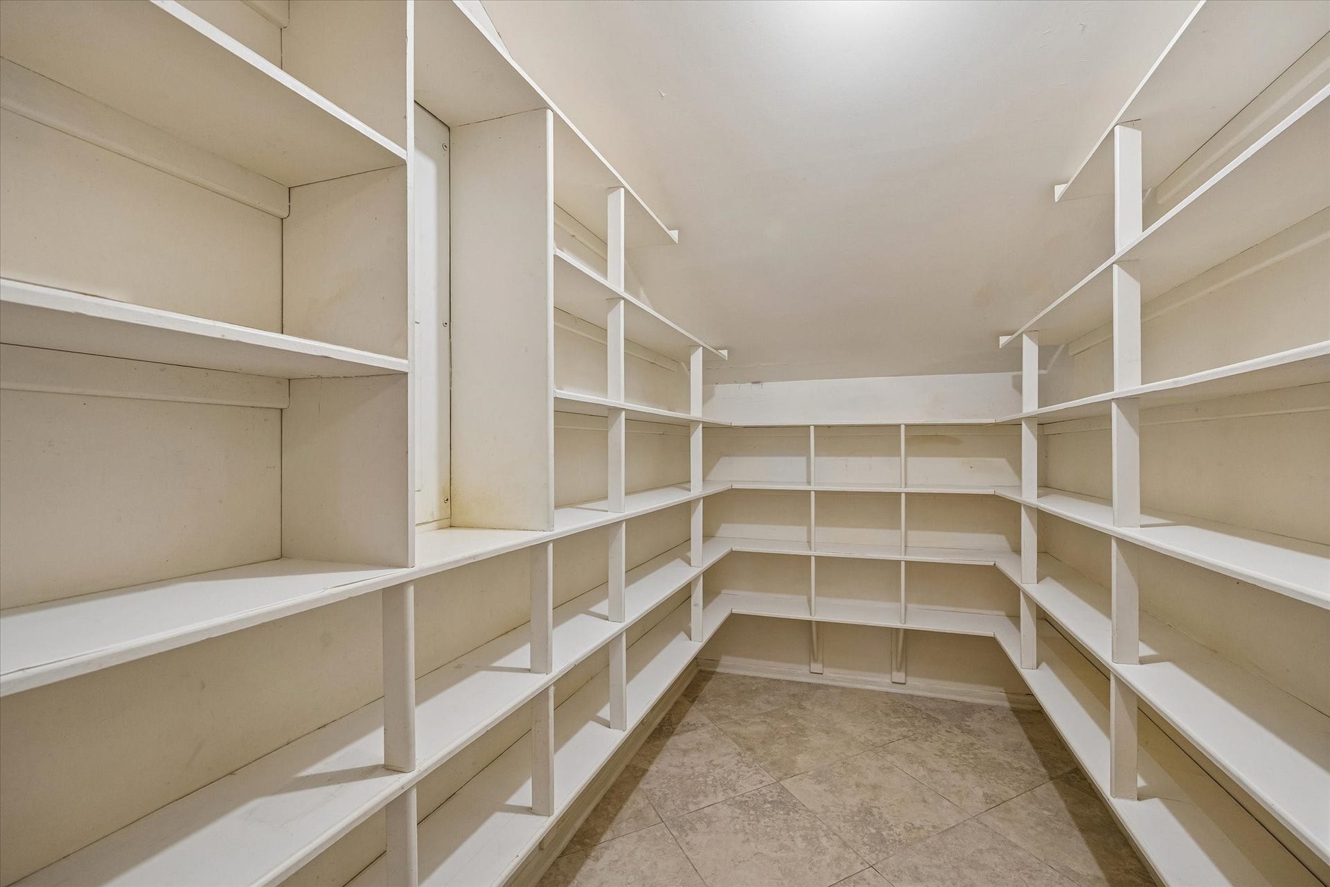 Large, deep walk-in pantry provides exceptional storage for groceries, small appliances and more.