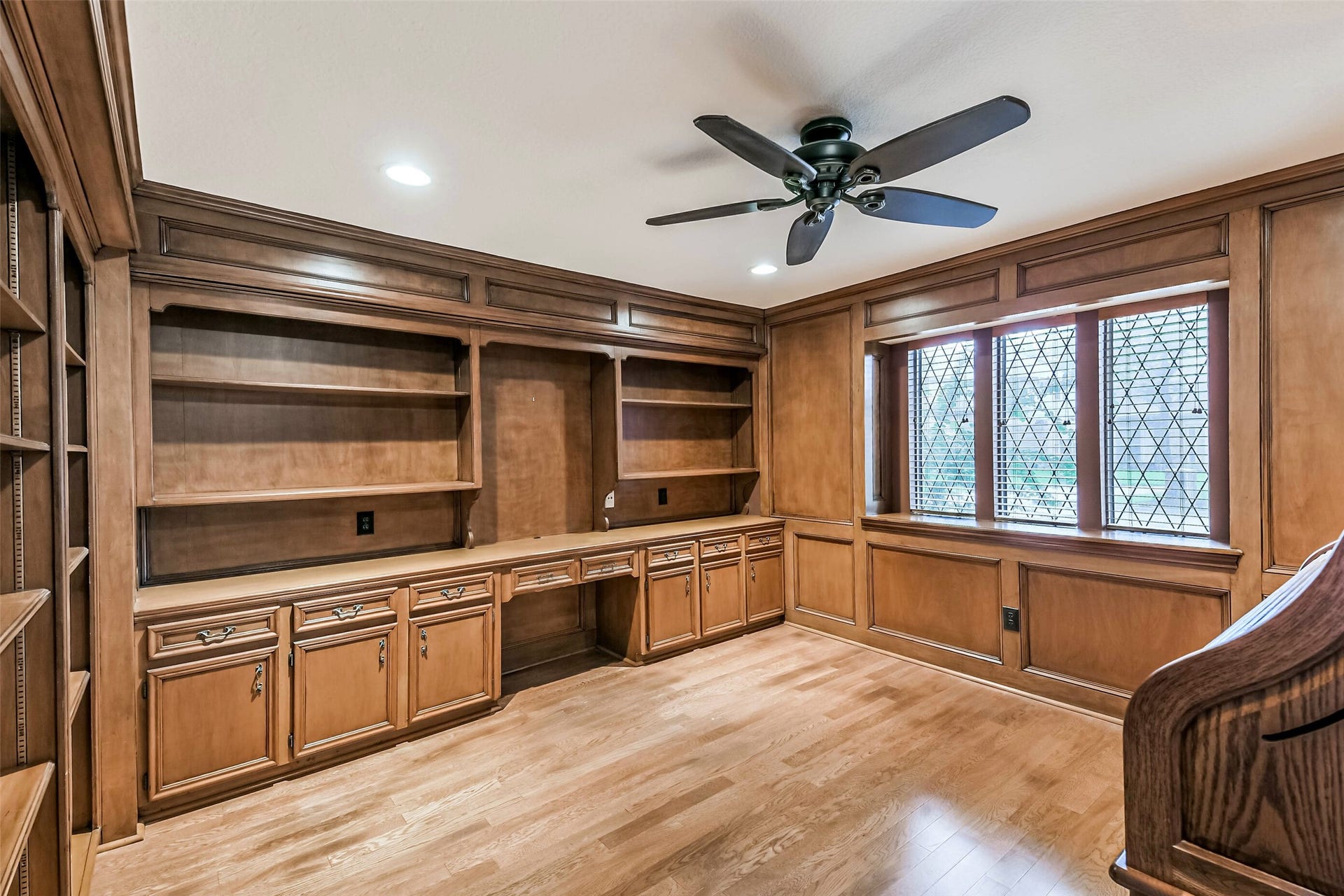 Private office/study with beautiful custom wood paneling.