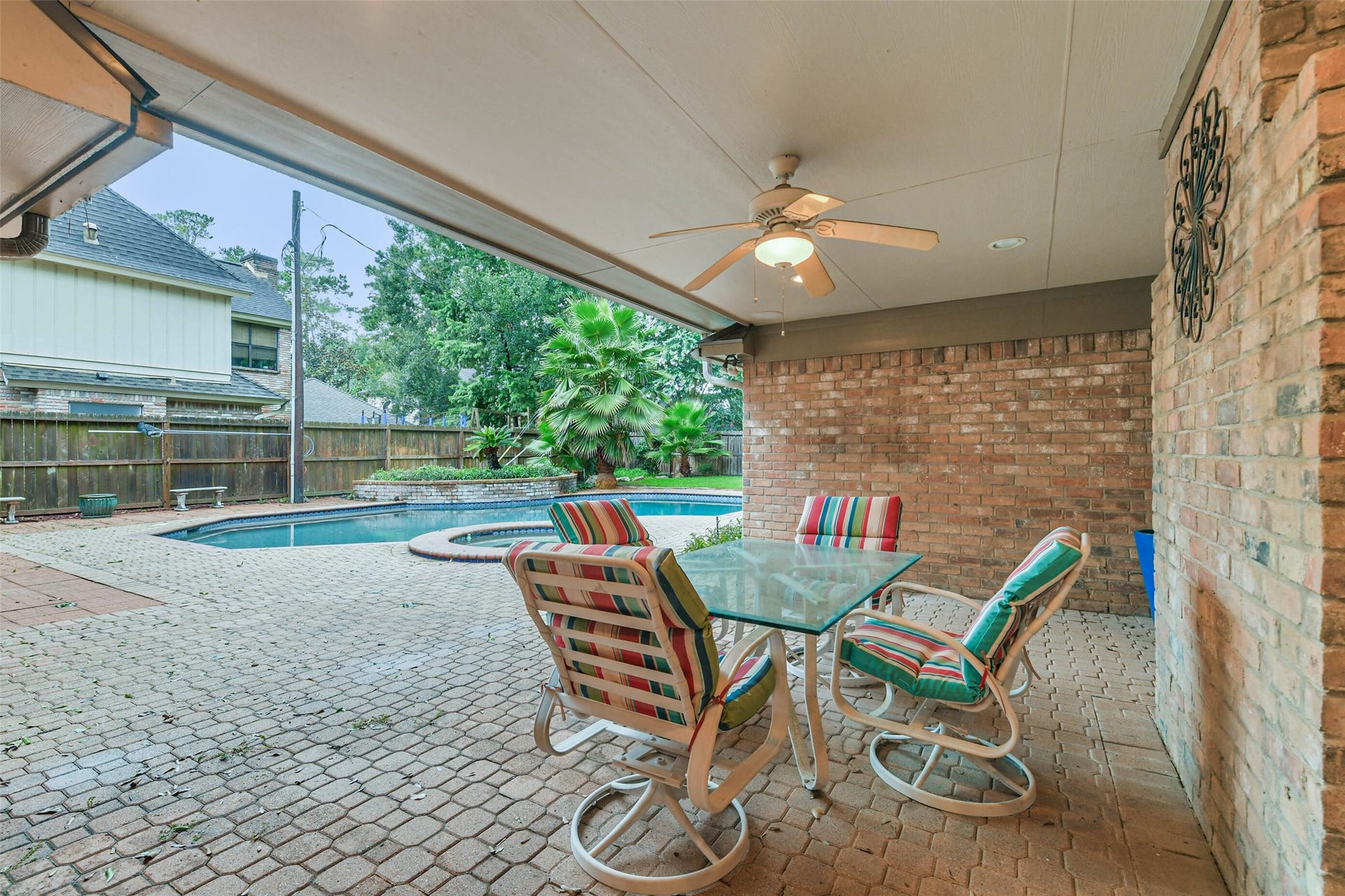 Large covered patio keeps you cool in the shade while watching the pool or hanging outdoors.