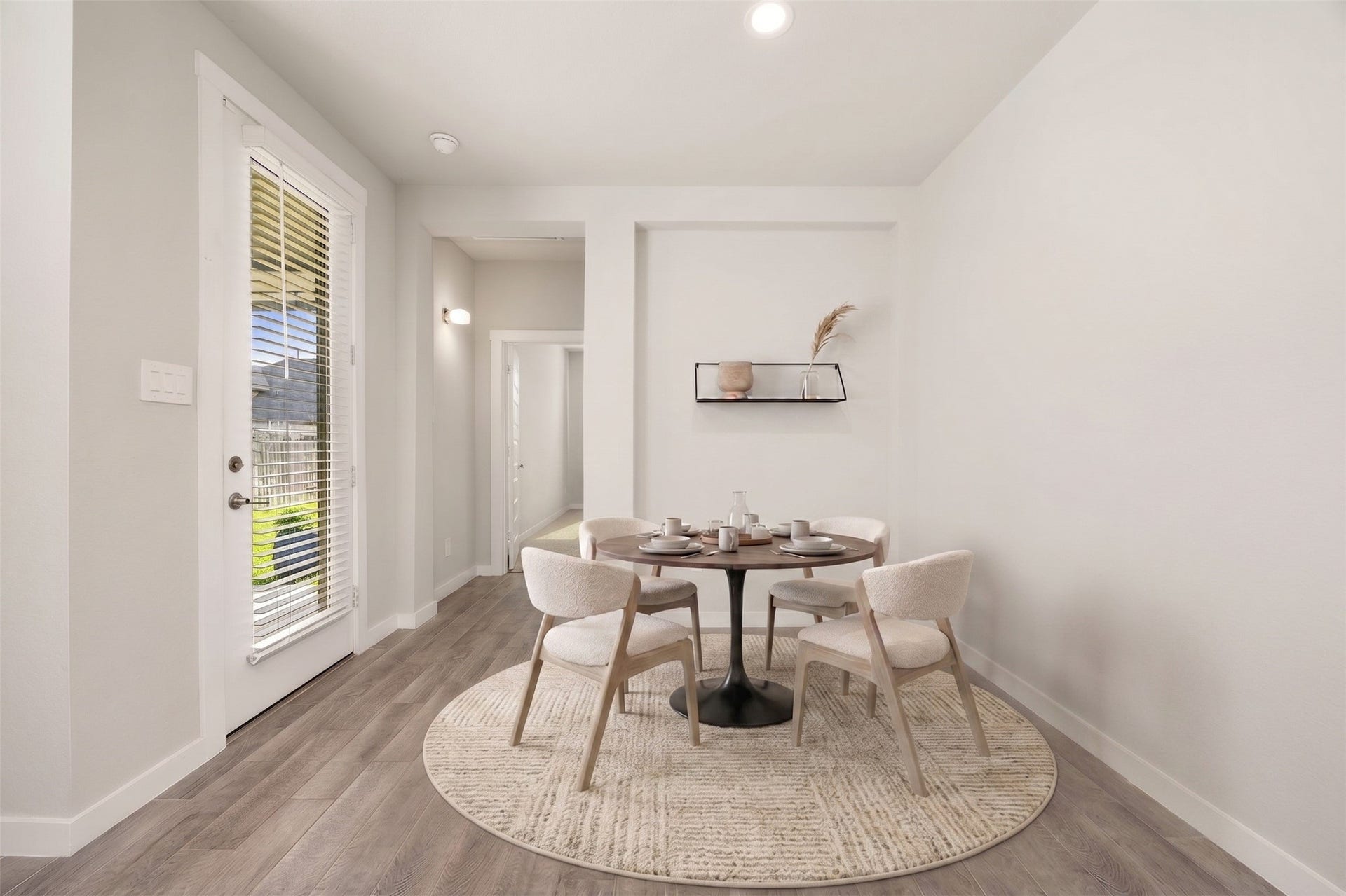 3815 Favor Forest Court, Katy, TX 77494 The sunlit breakfast area offers a relaxed spot for casual meals, with direct access to the backyard just steps away. Virtually staged.