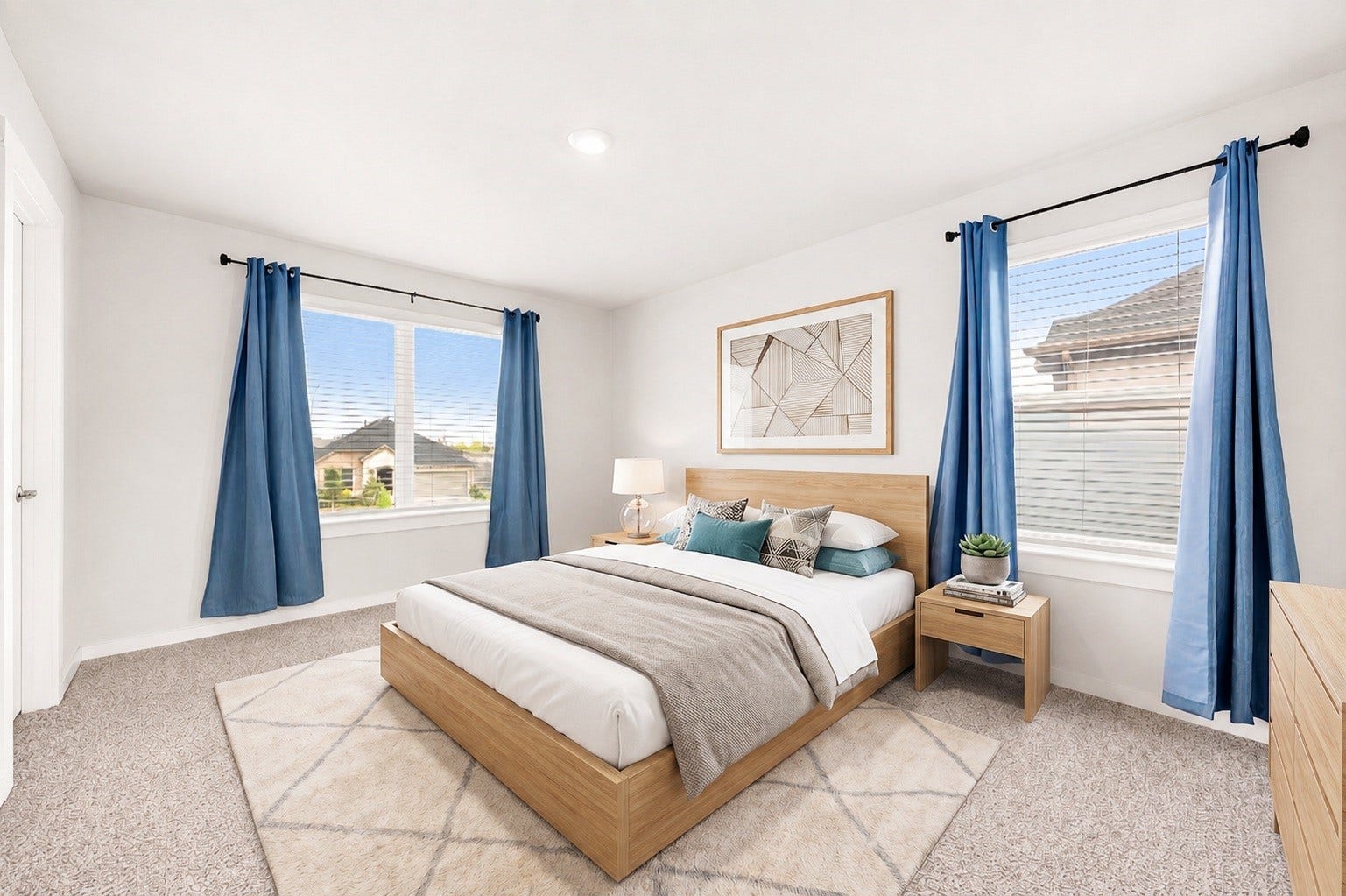3815 Favor Forest Court, Katy, TX 77494 This secondary bedroom offers plush carpet and two large windows, creating a bright and comfortable space. Virtually staged.