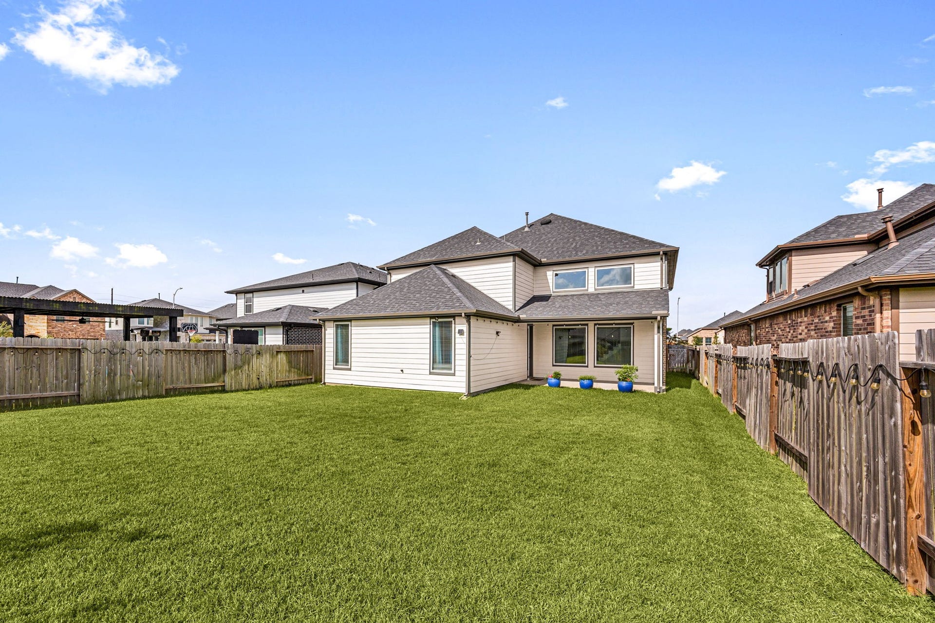 3815 Favor Forest Court, Katy, TX 77494 The fully fenced backyard offers a generous, level lawn with plenty of room to play, garden, or entertain.