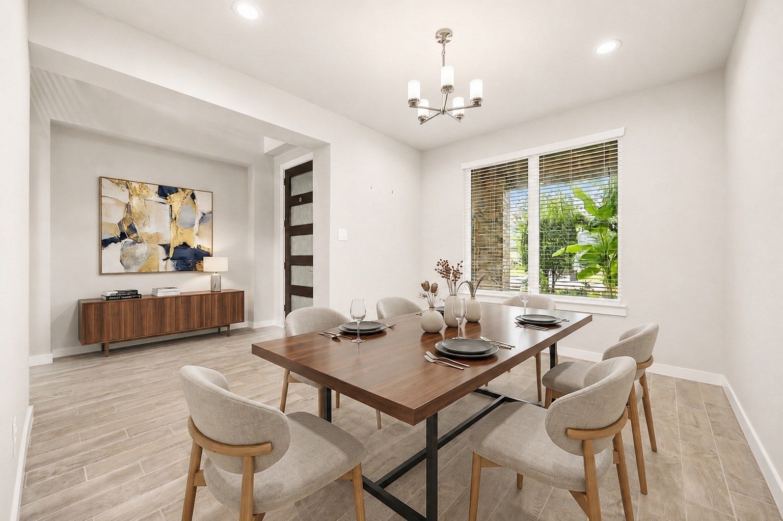 3815 Favor Forest Court, Katy, TX 77494 Just off the foyer, the formal dining area makes an elegant statement with a modern chandelier and a large window overlooking the front yard. Virtually staged.