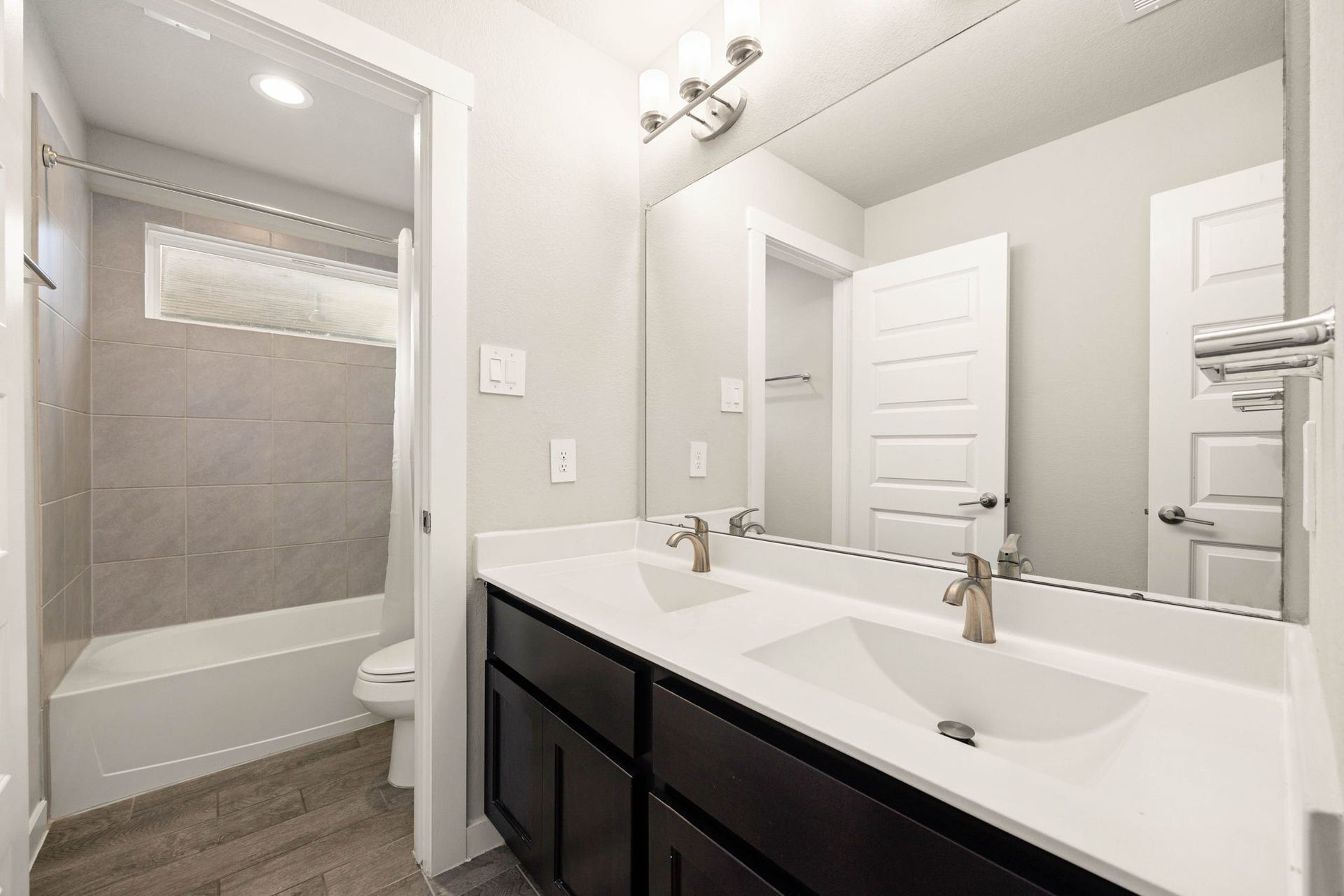 3815 Favor Forest Court, Katy, TX 77494 This secondary bath features a double vanity and a tub/shower combo, convenient for family or guests.