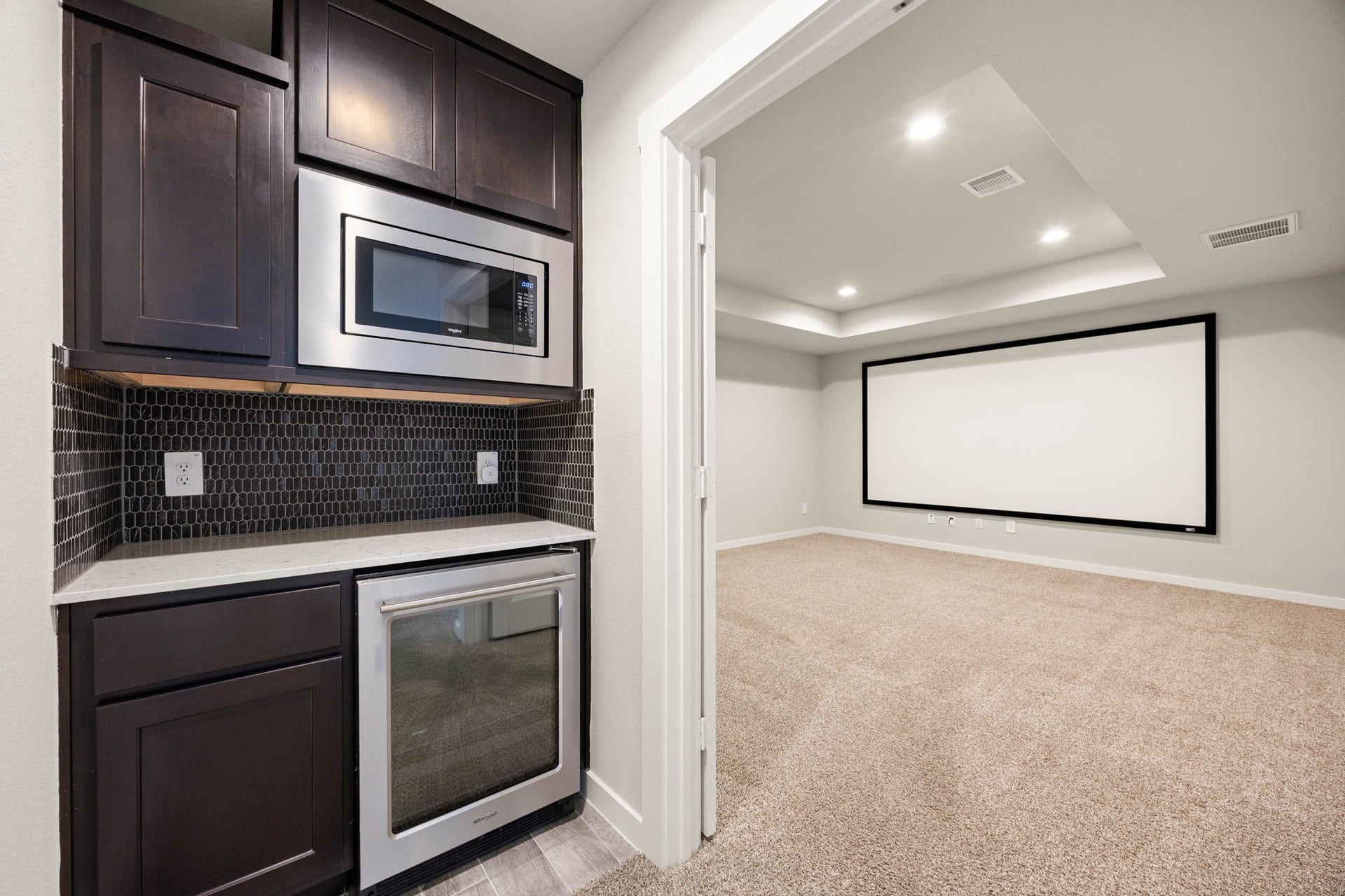 3815 Favor Forest Court, Katy, TX 77494 The wet bar features a built-in microwave and beverage refrigerator, perfect for hosting movie nights or game days.