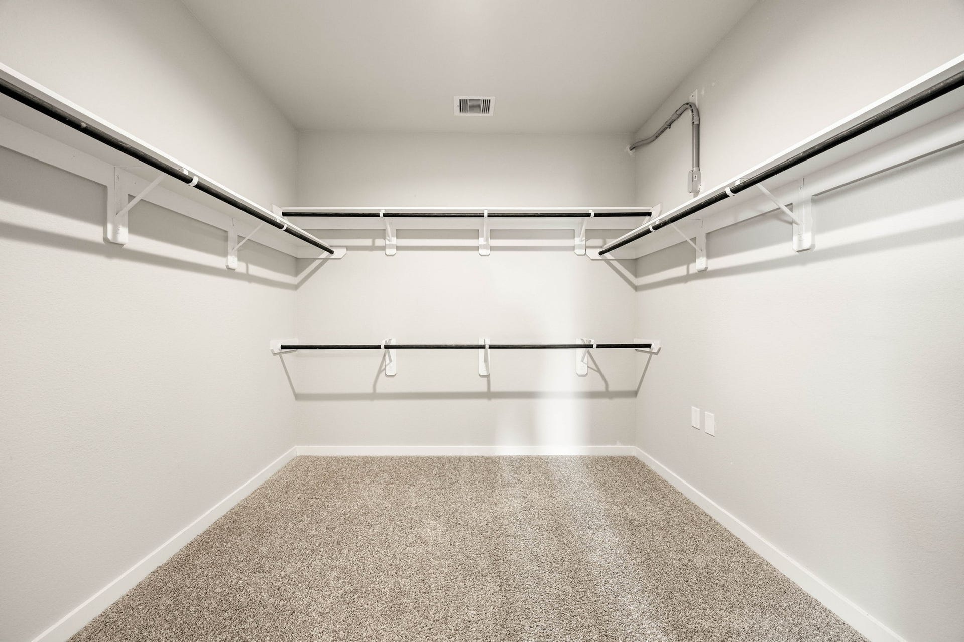 3815 Favor Forest Court, Katy, TX 77494 The primary suite's spacious walk-in closet offers built-in shelving and hanging space for organized storage.
