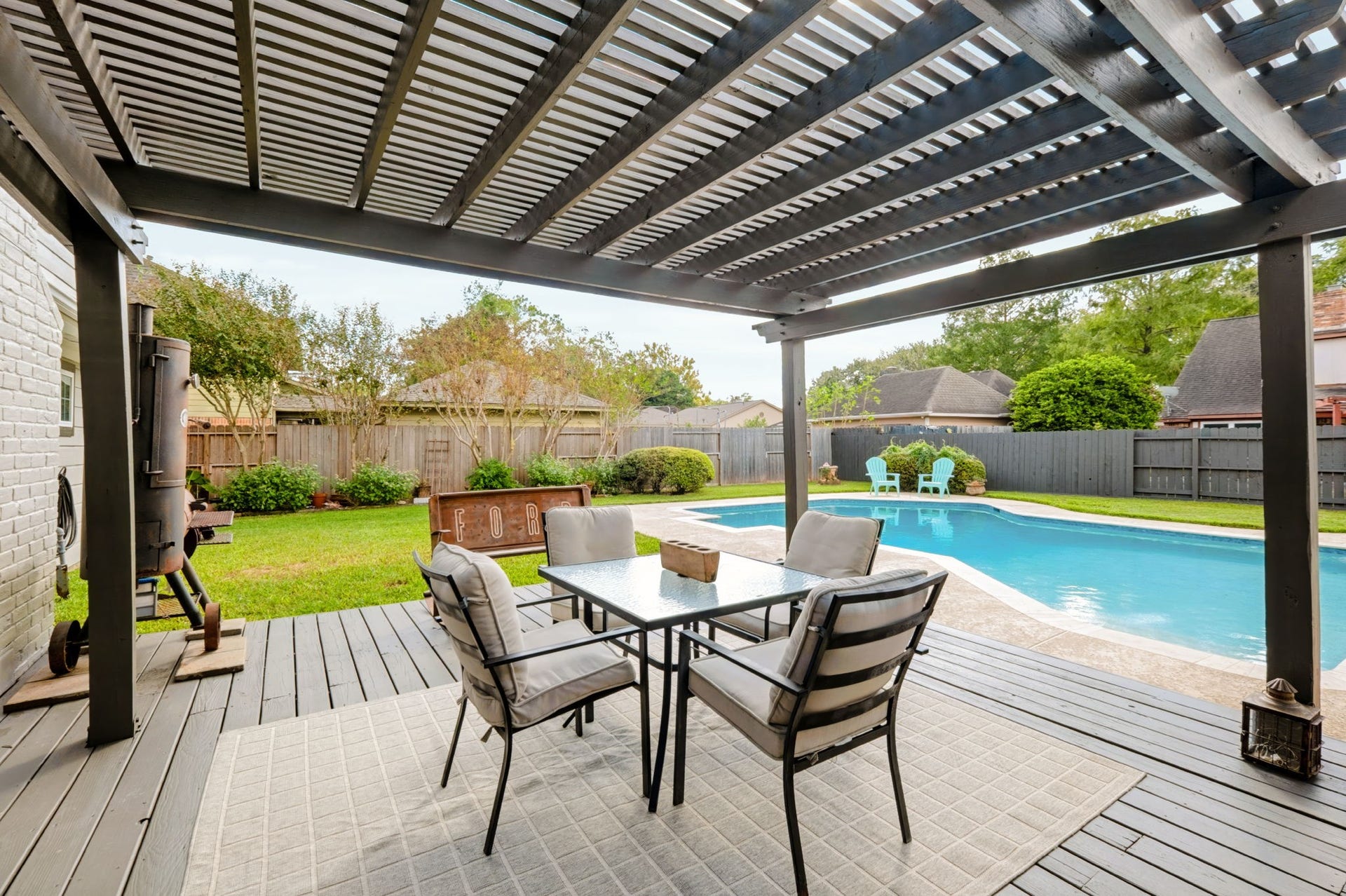 3507 Rolling Green Lane, Missouri City, TX 77459 New covered deck overlooking the recently redone swimming pool, creating an inviting outdoor entertaining space with views of the private, fenced backyard.