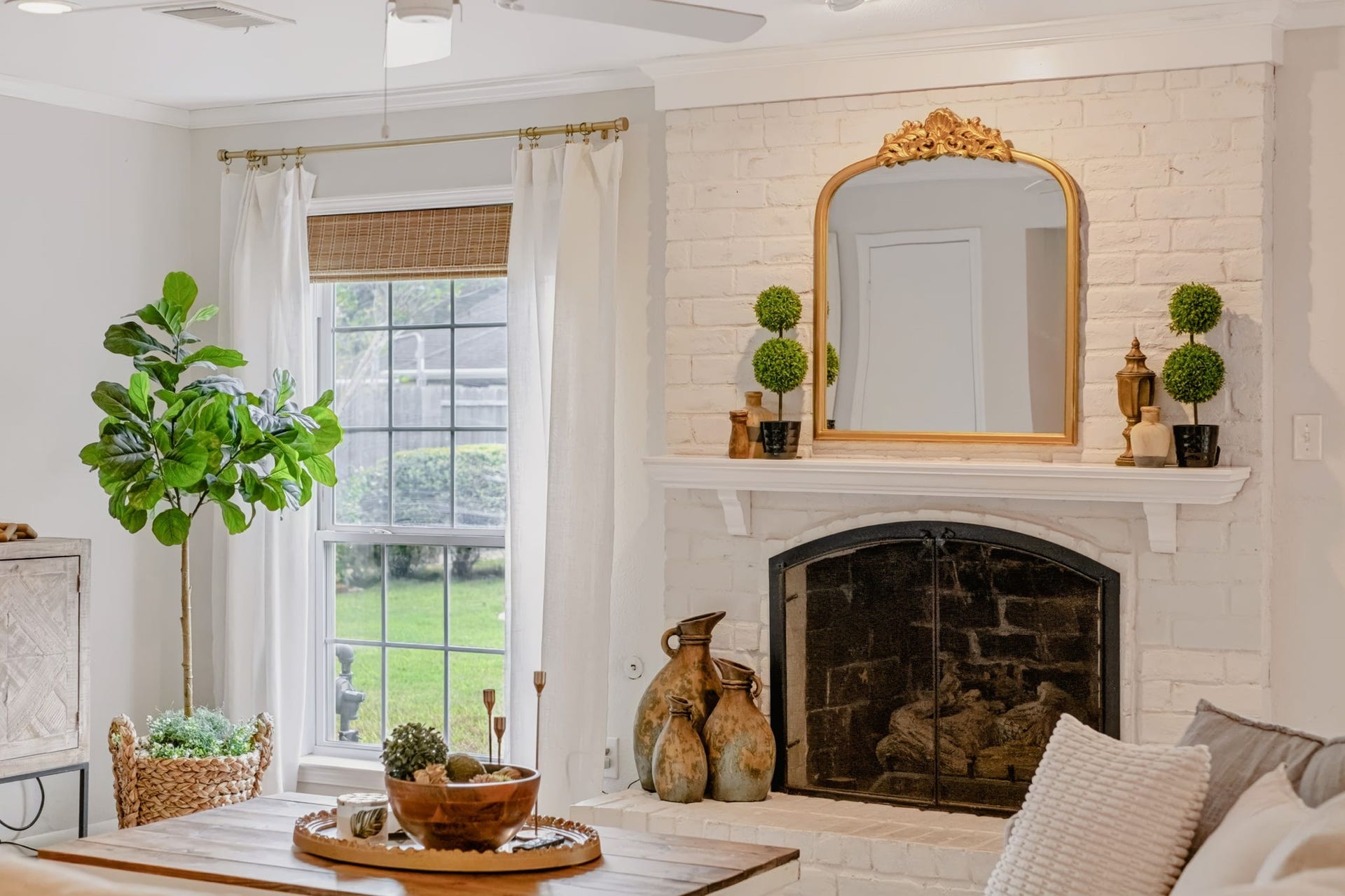 3507 Rolling Green Lane, Missouri City, TX 77459 Bright living area featuring a fireplace and new LED lighting.