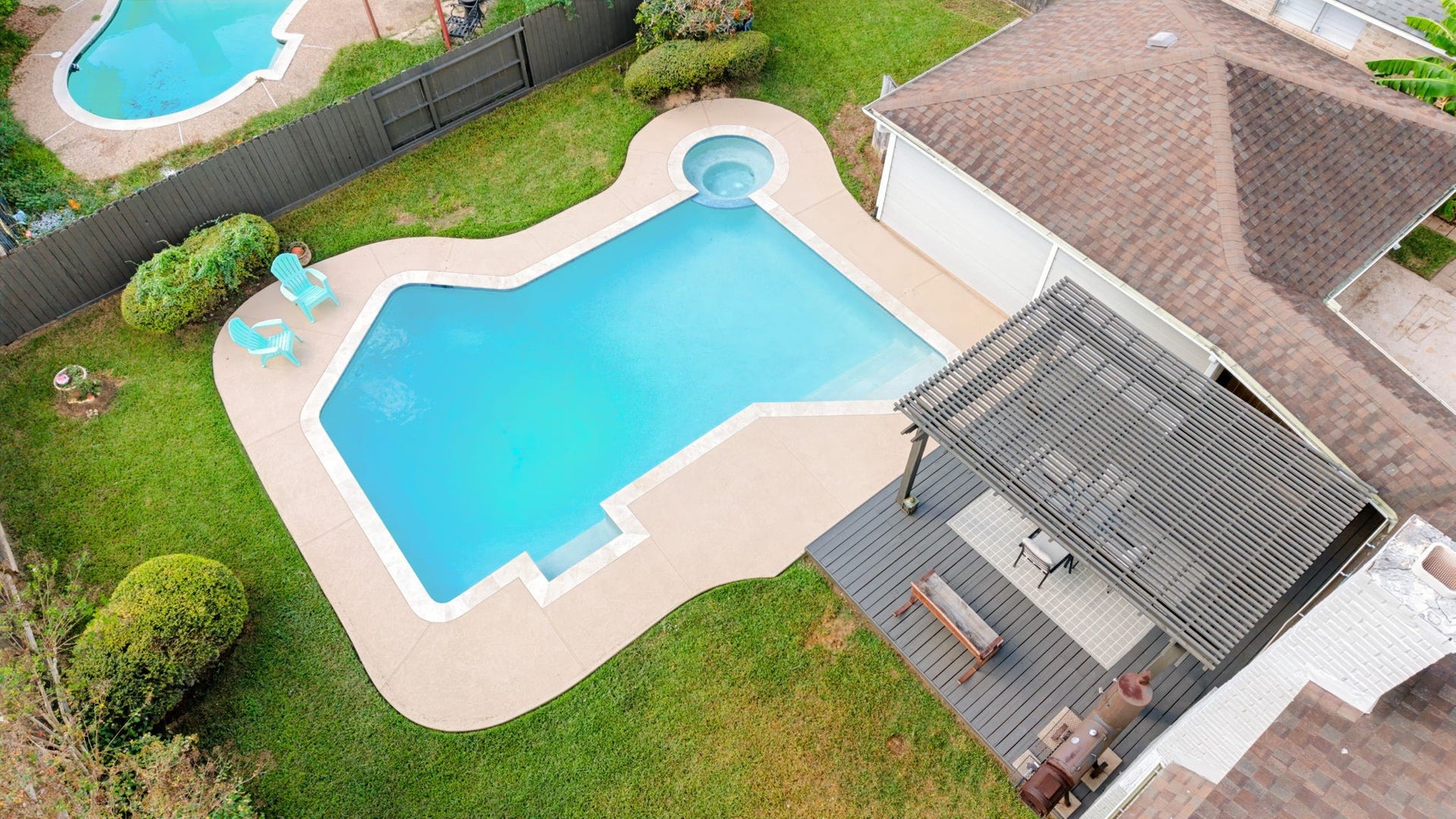 3507 Rolling Green Lane, Missouri City, TX 77459 Aerial view of the recently redone pool, updated pool area, and new deck.