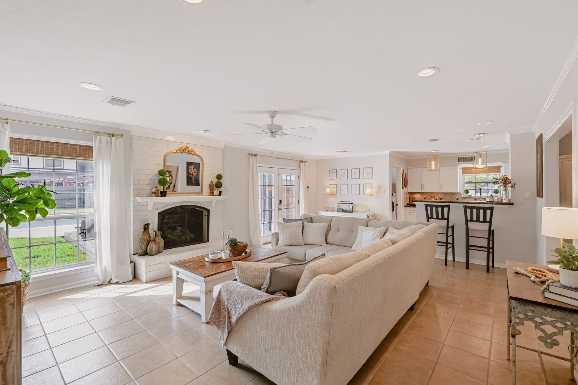 3507 Rolling Green Lane, Missouri City, TX 77459 Spacious open-concept living area with abundant natural light and a fireplace.