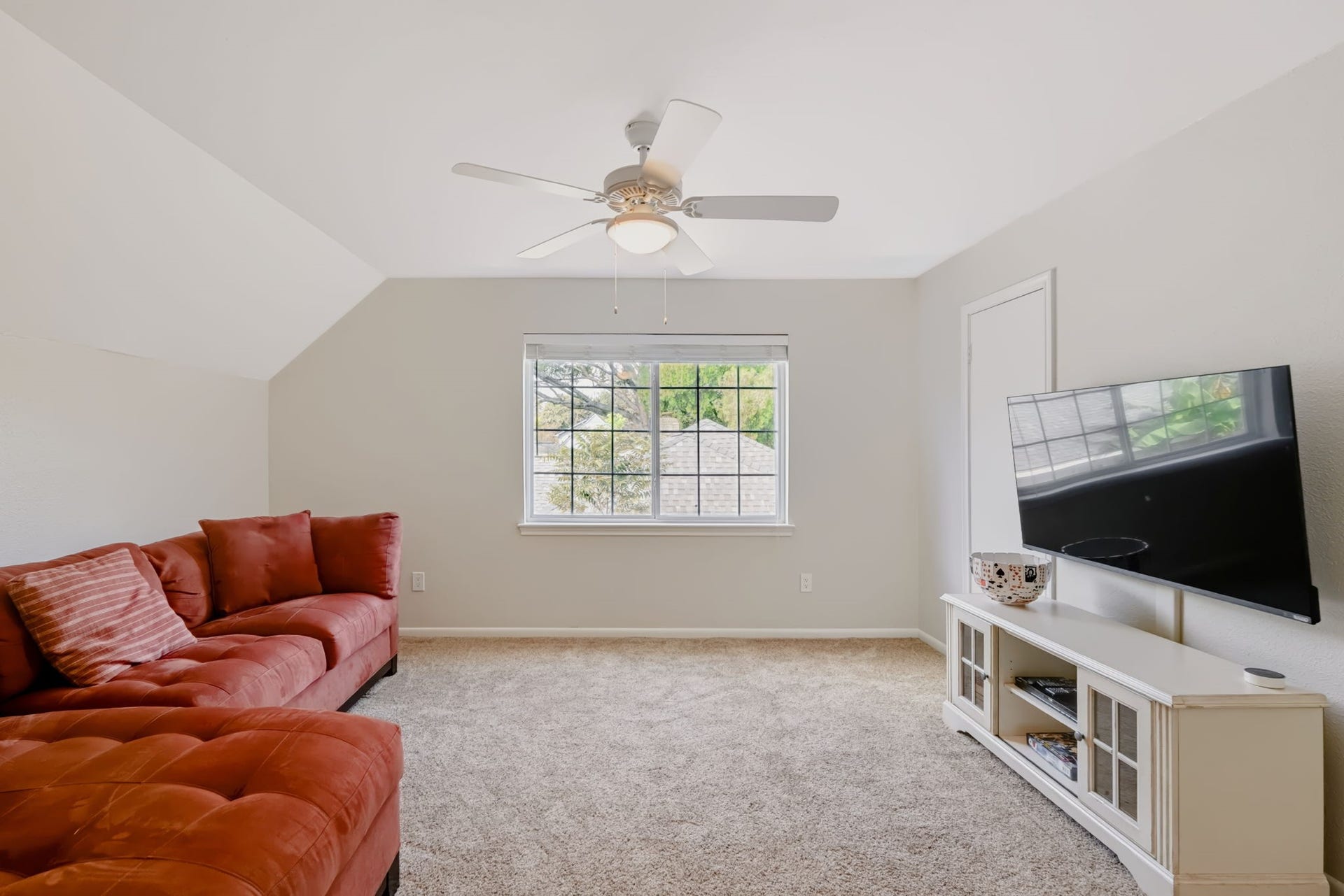 3507 Rolling Green Lane, Missouri City, TX 77459 Versatile upstairs game room featuring new LED lighting, a ceiling fan, and flexible space for a media room, recreational activities, or additional living area.