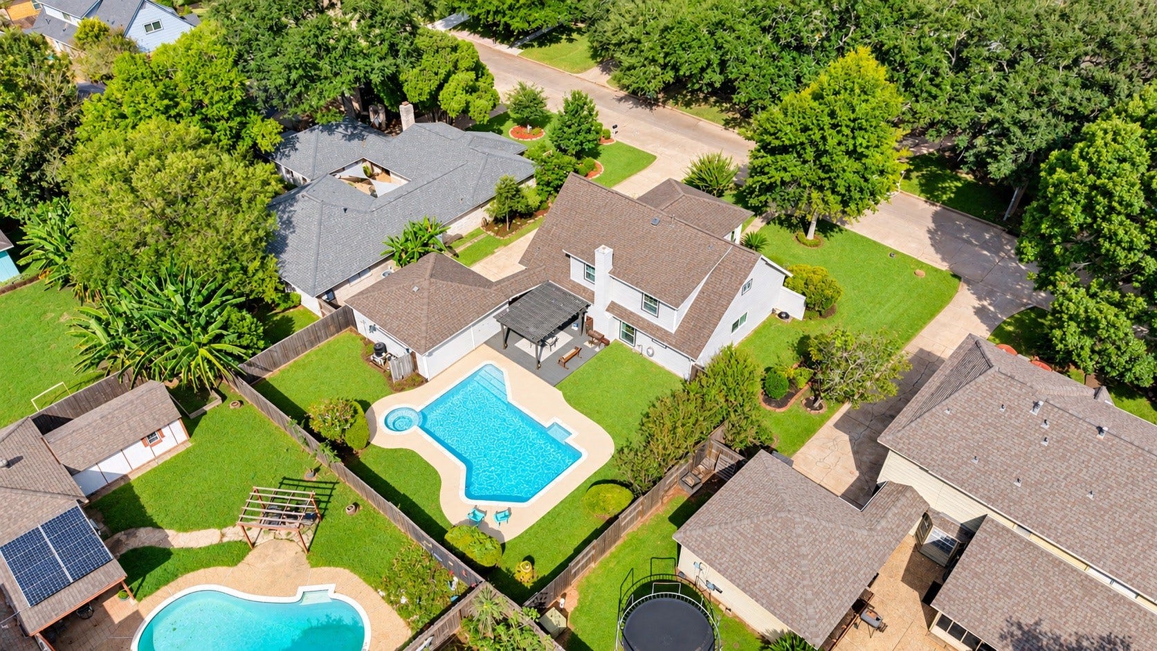 3507 Rolling Green Lane, Missouri City, TX 77459 Elevated view showcasing the home, private backyard, and recently redone pool.