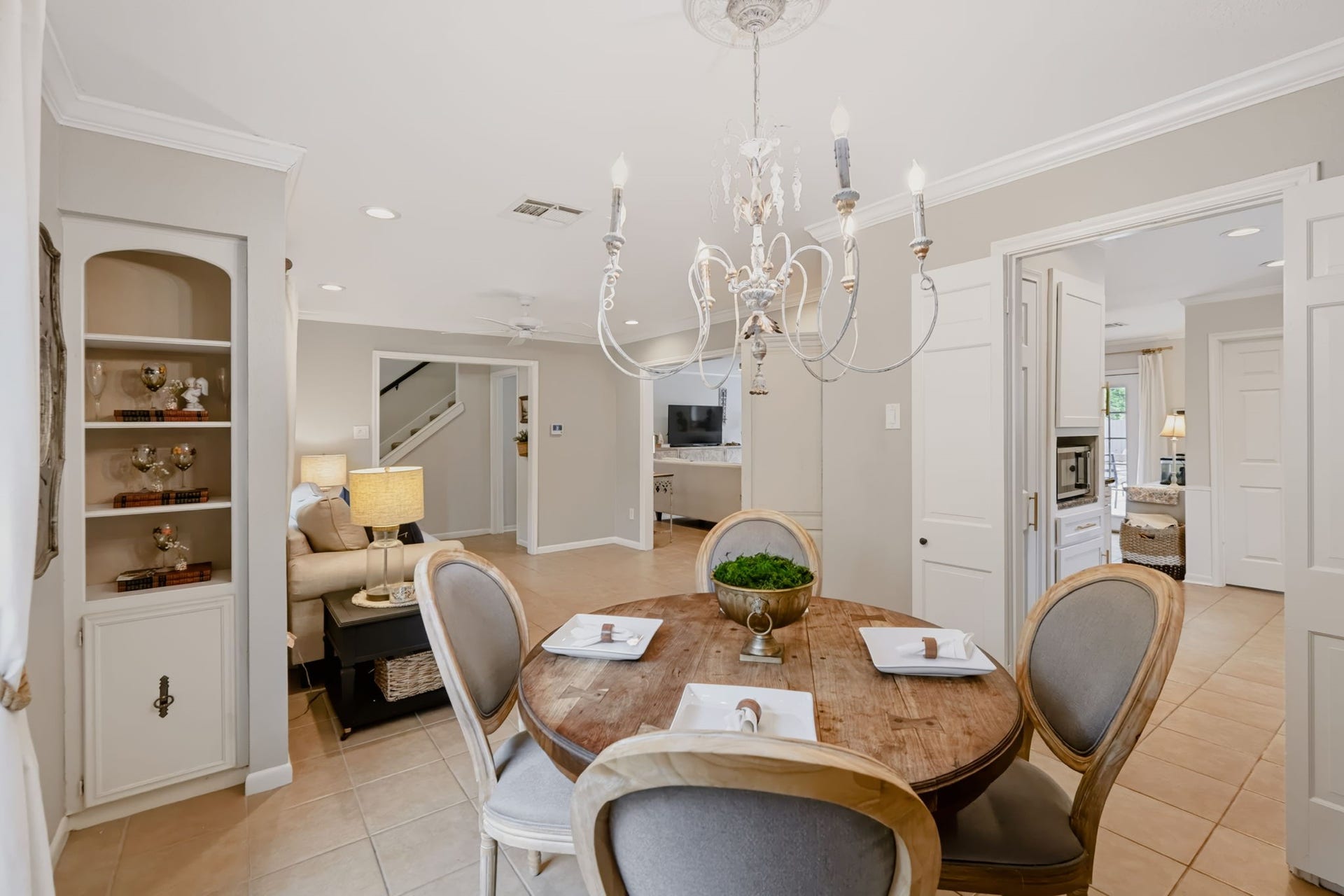 3507 Rolling Green Lane, Missouri City, TX 77459 Formal dining area featuring built-in display storage and an updated light fixture.