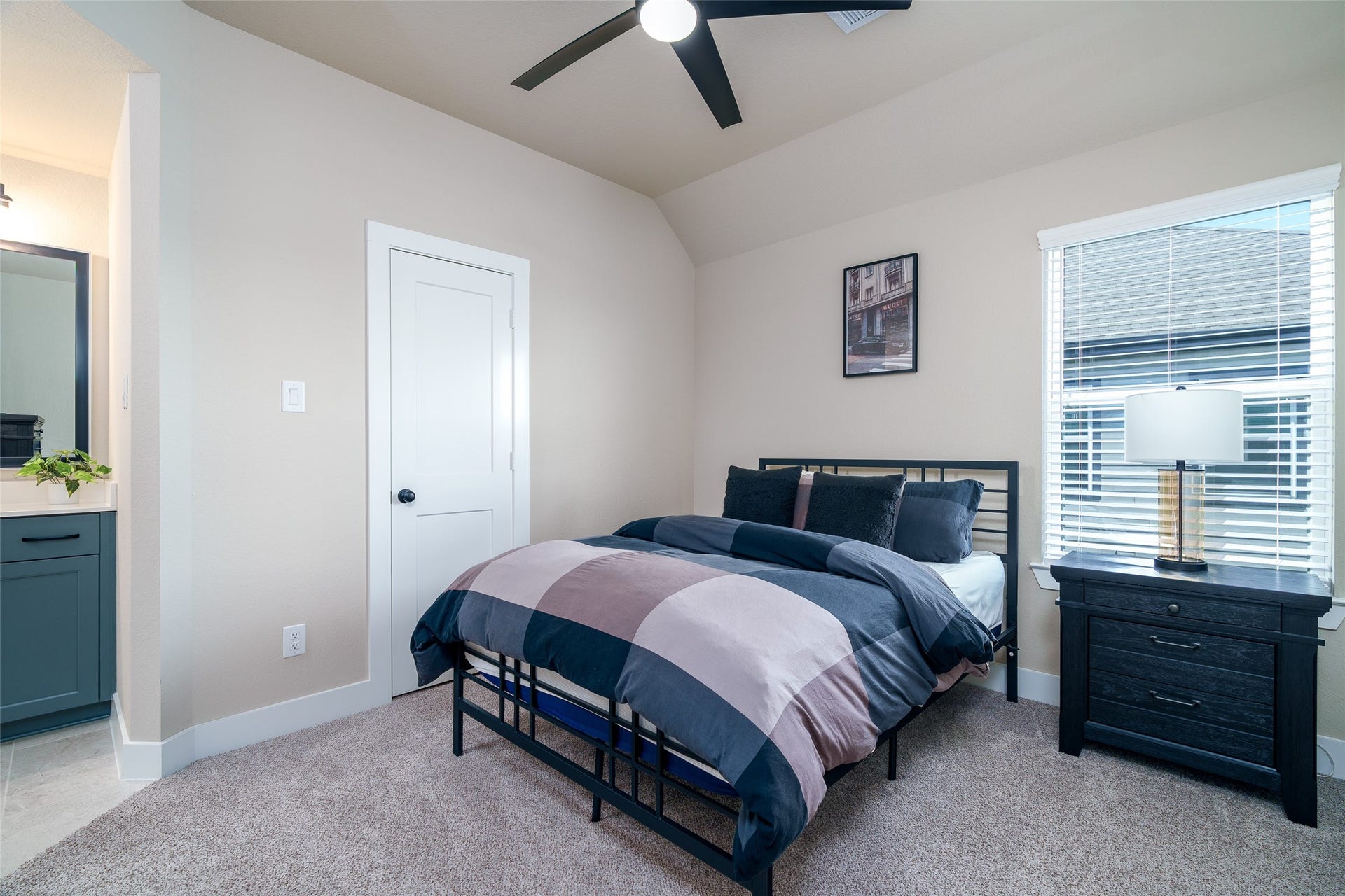 3348 Voda Bend Drive, Katy, TX 77493 This bedroom features the convenience of a private sink and direct access to a shared bathroom, offering both privacy and functionality.