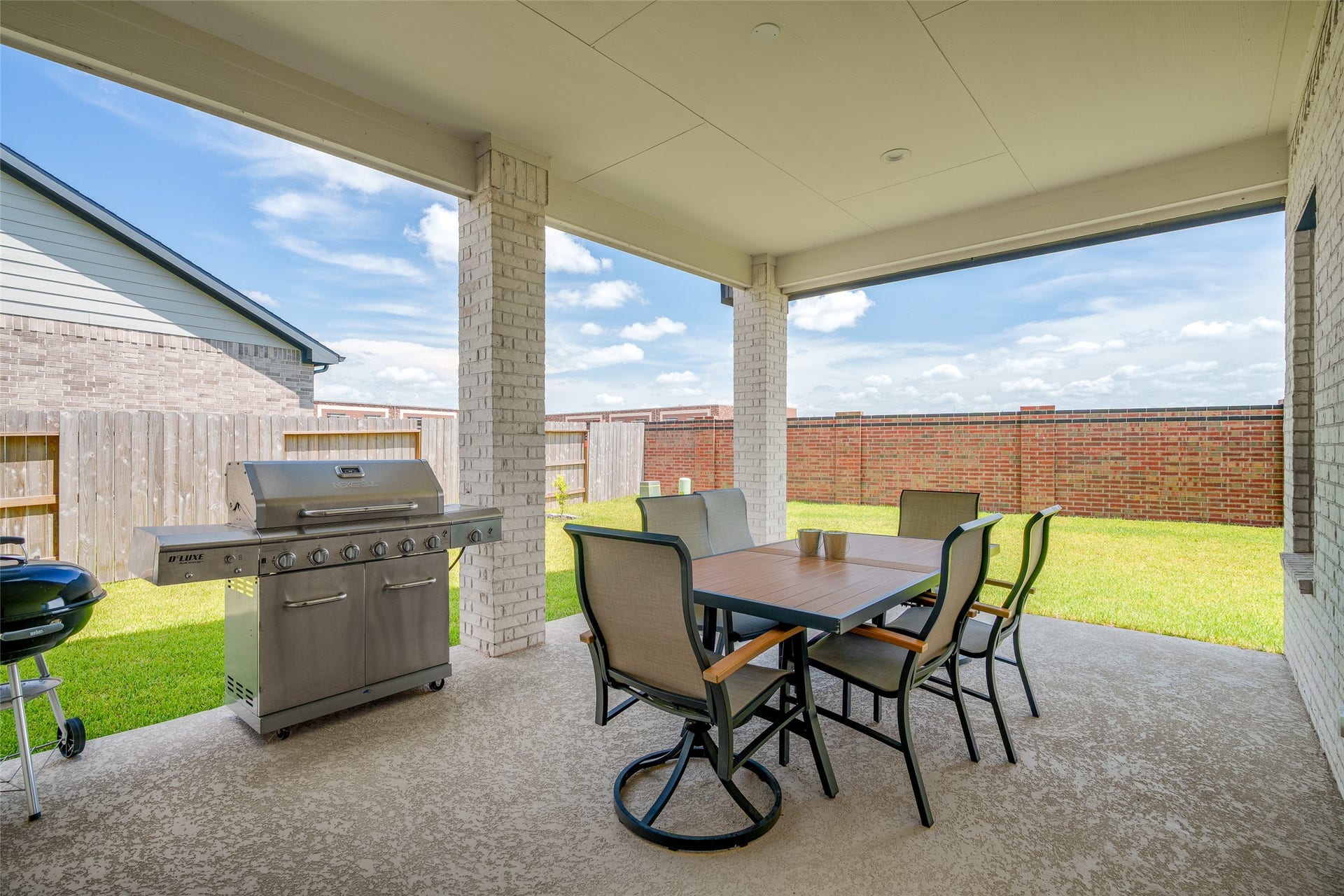 3348 Voda Bend Drive, Katy, TX 77493 The backyard features an upgraded covered patio, perfect for outdoor relaxation and entertaining.