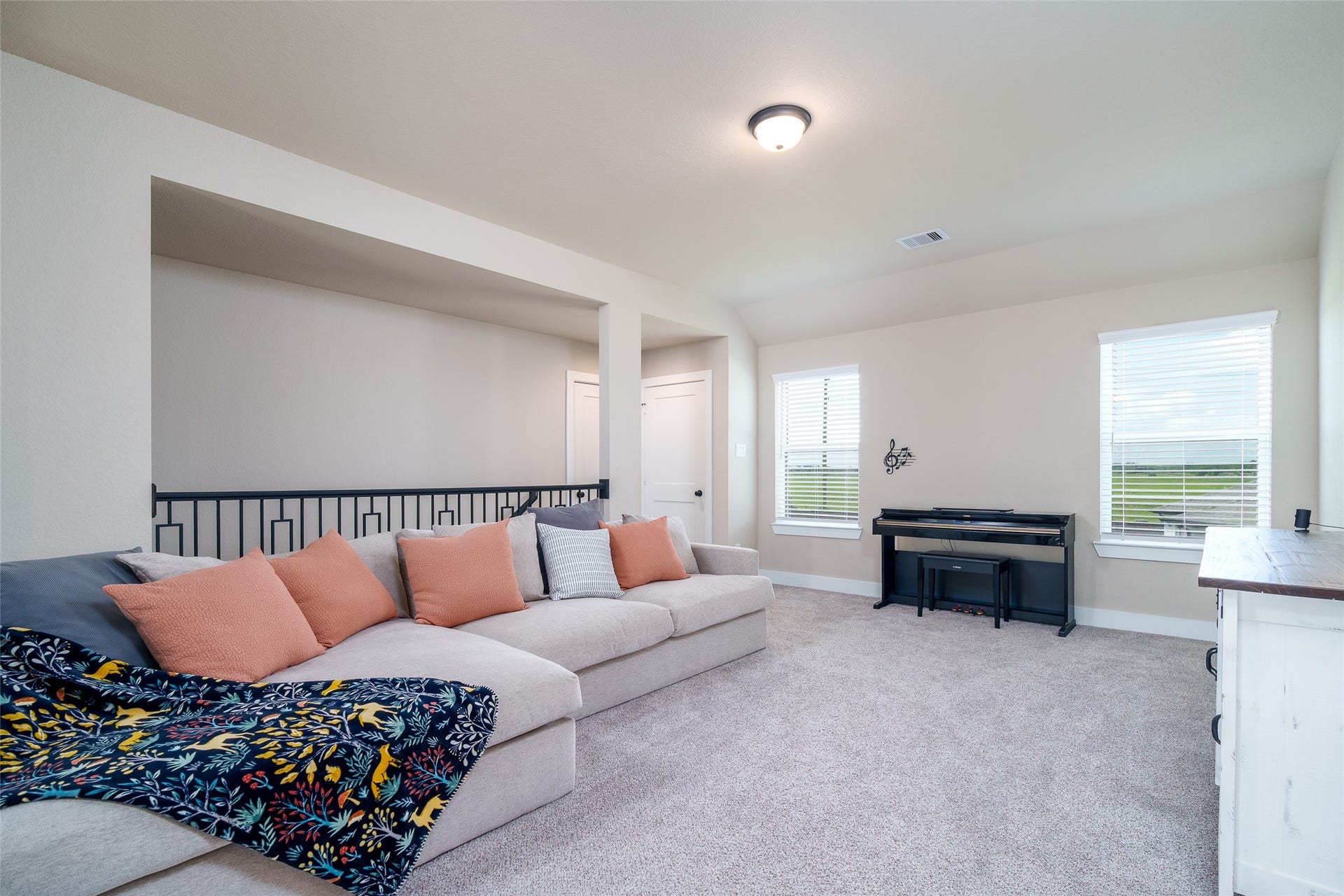 3348 Voda Bend Drive, Katy, TX 77493 The game room offers a vibrant space to relax or entertain, featuring custom paint, plush carpet, and windows with privacy blinds to control light and ambiance.