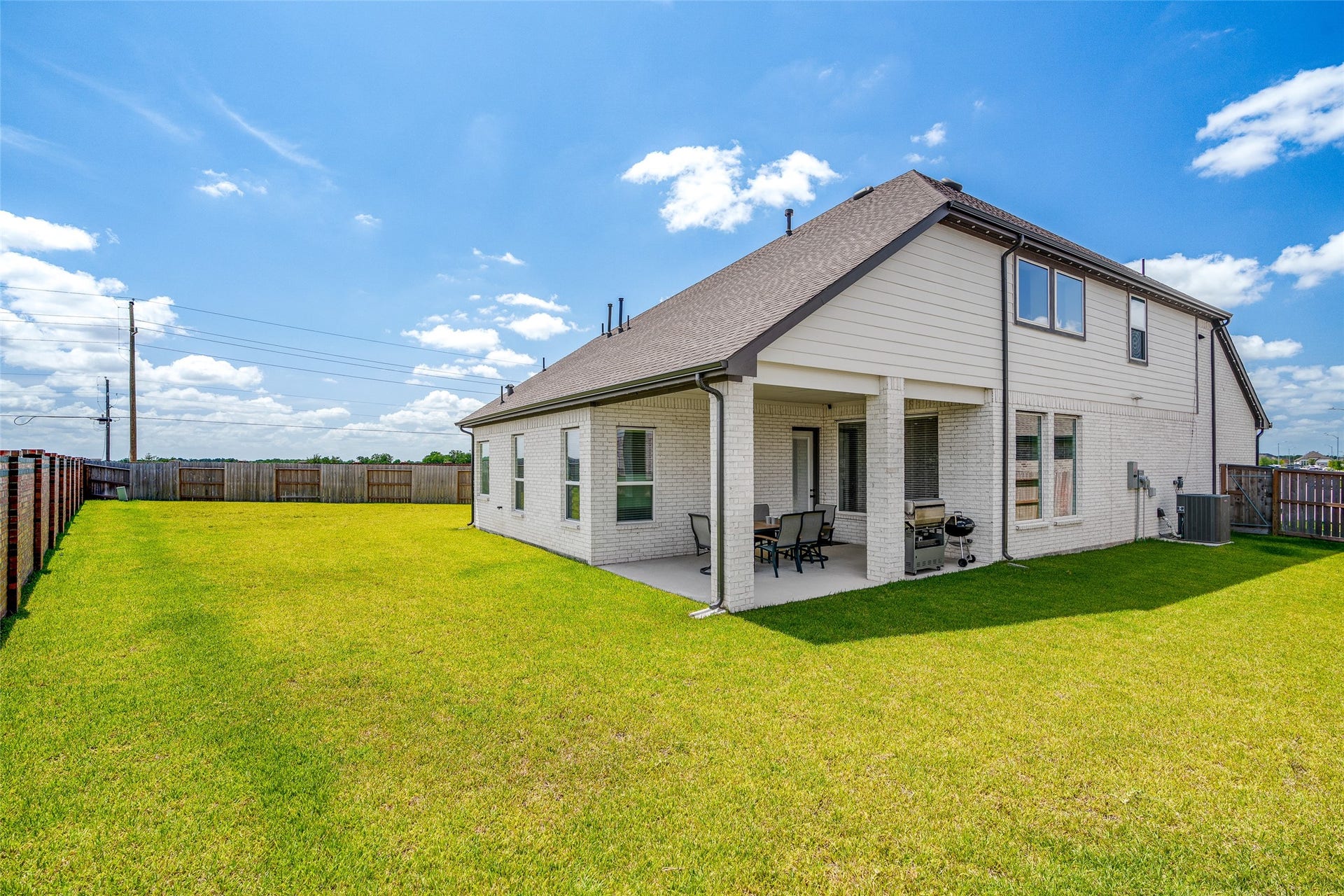 3348 Voda Bend Drive, Katy, TX 77493 Step into your private outdoor retreat .This oversized backyard boasts a spacious covered patio and a lush lawn, all enclosed by a privacy fence for the perfect blend of comfort and seclusion.