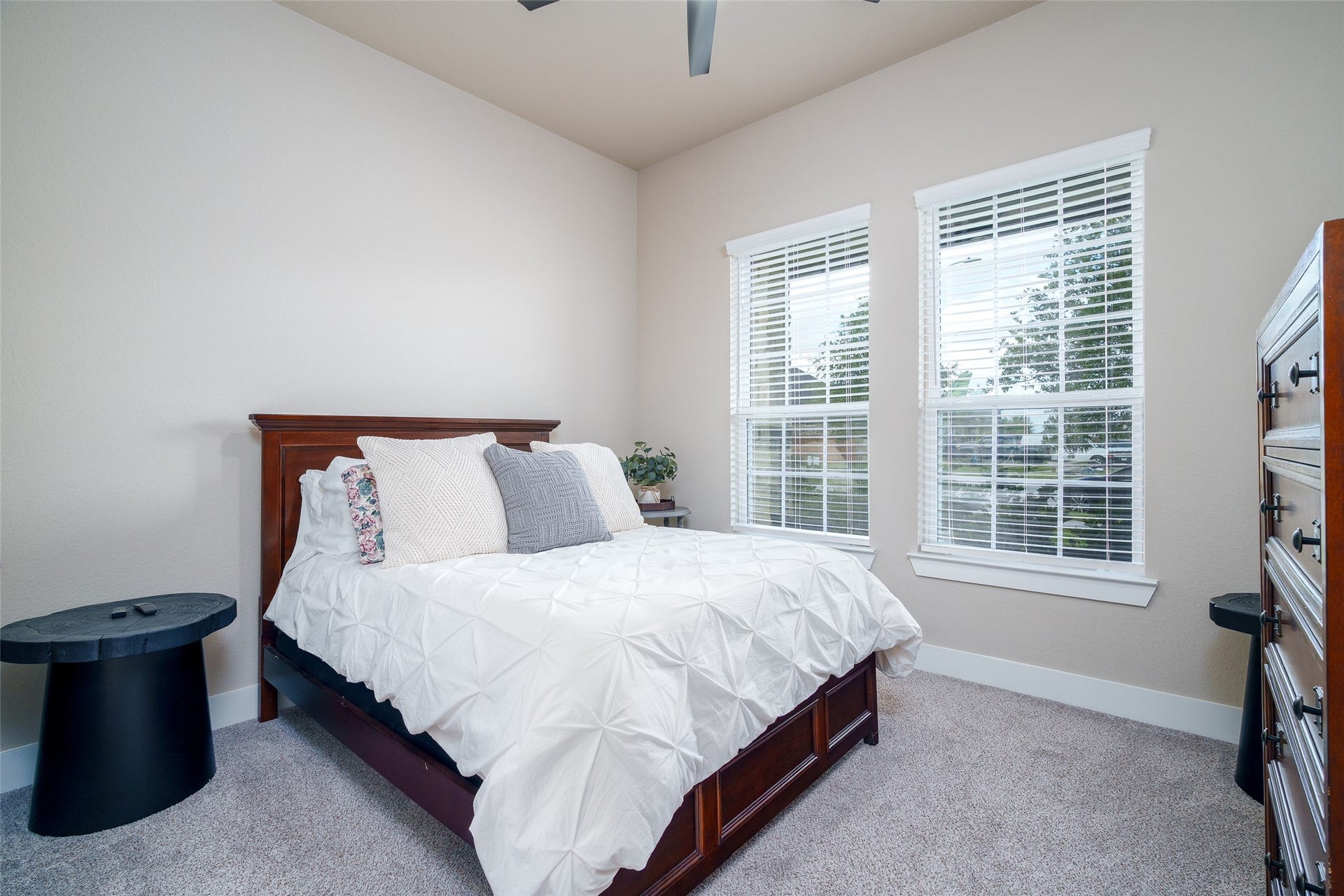 3348 Voda Bend Drive, Katy, TX 77493 This charming bedroom features soft carpet flooring, a ceiling fan for added comfort, and a window with privacy blinds to let in natural light while maintaining your personal space.