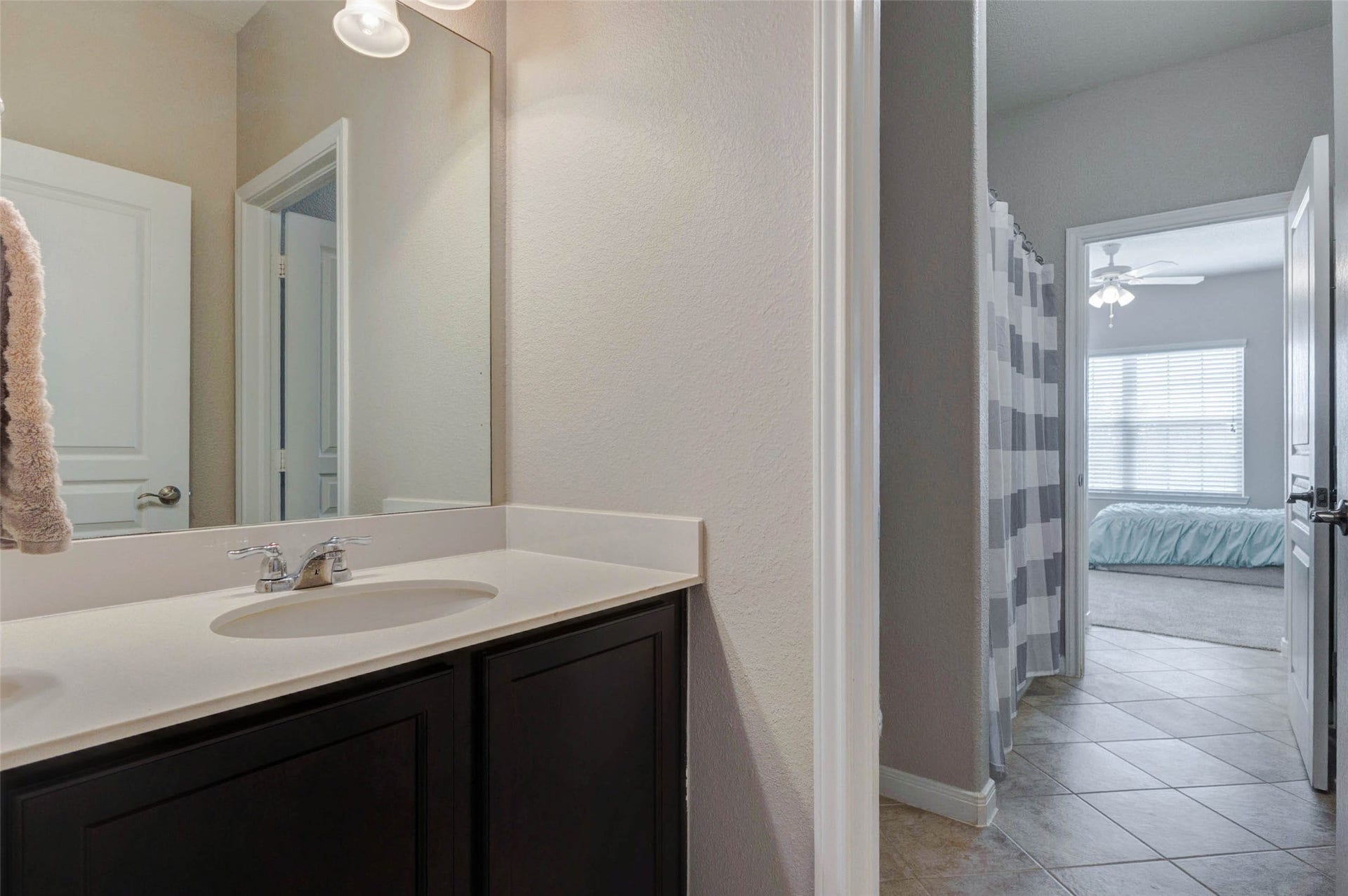 30218 Creekside Drive, Brookshire, TX 77423 This part of the Jack-n-Jill shows the sink area that can be closed off from the middle area where the shower/tub combination is.