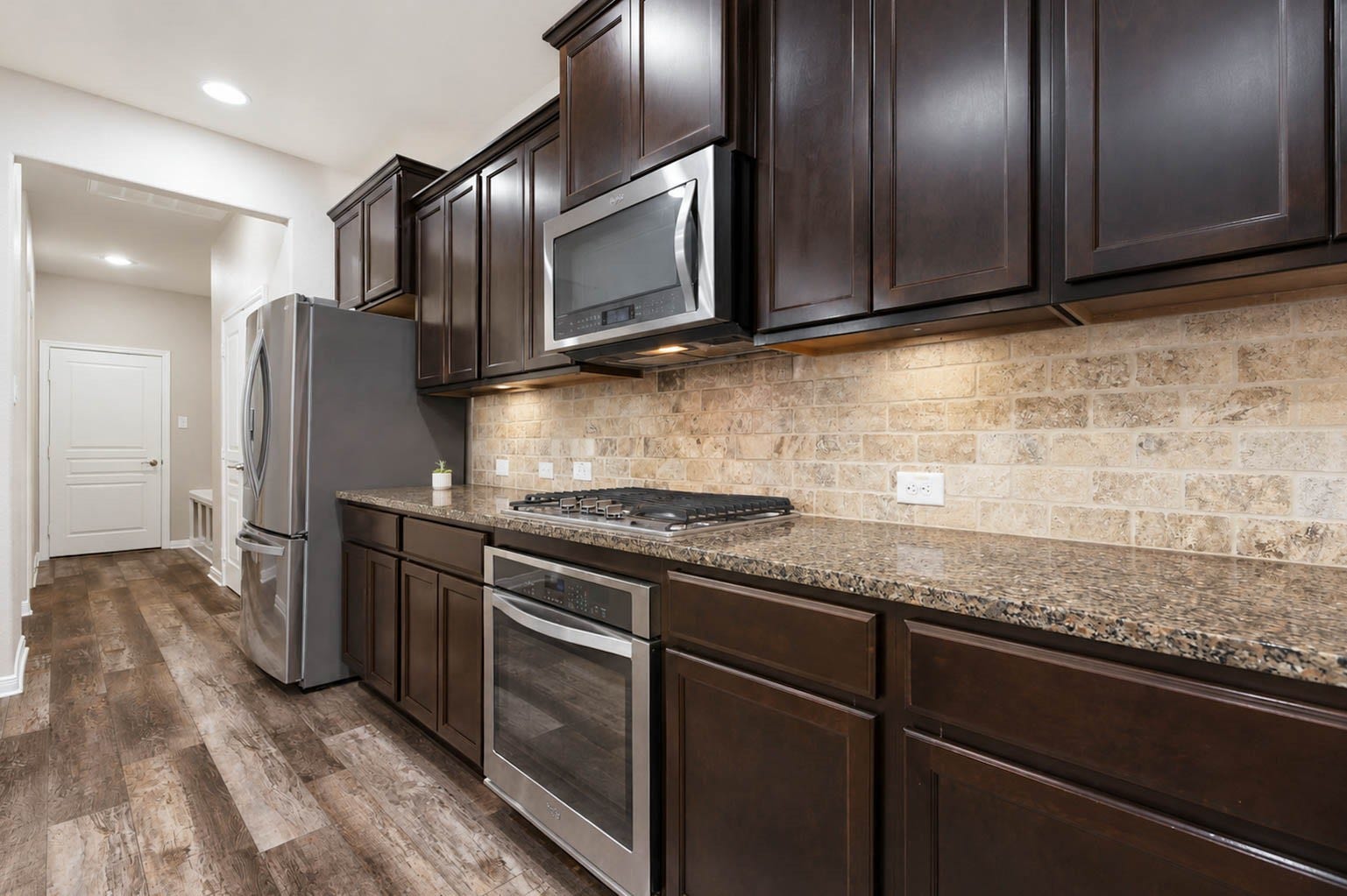 30218 Creekside Drive, Brookshire, TX 77423 The layout of the kitchen works well for having several people prepping and cooking.