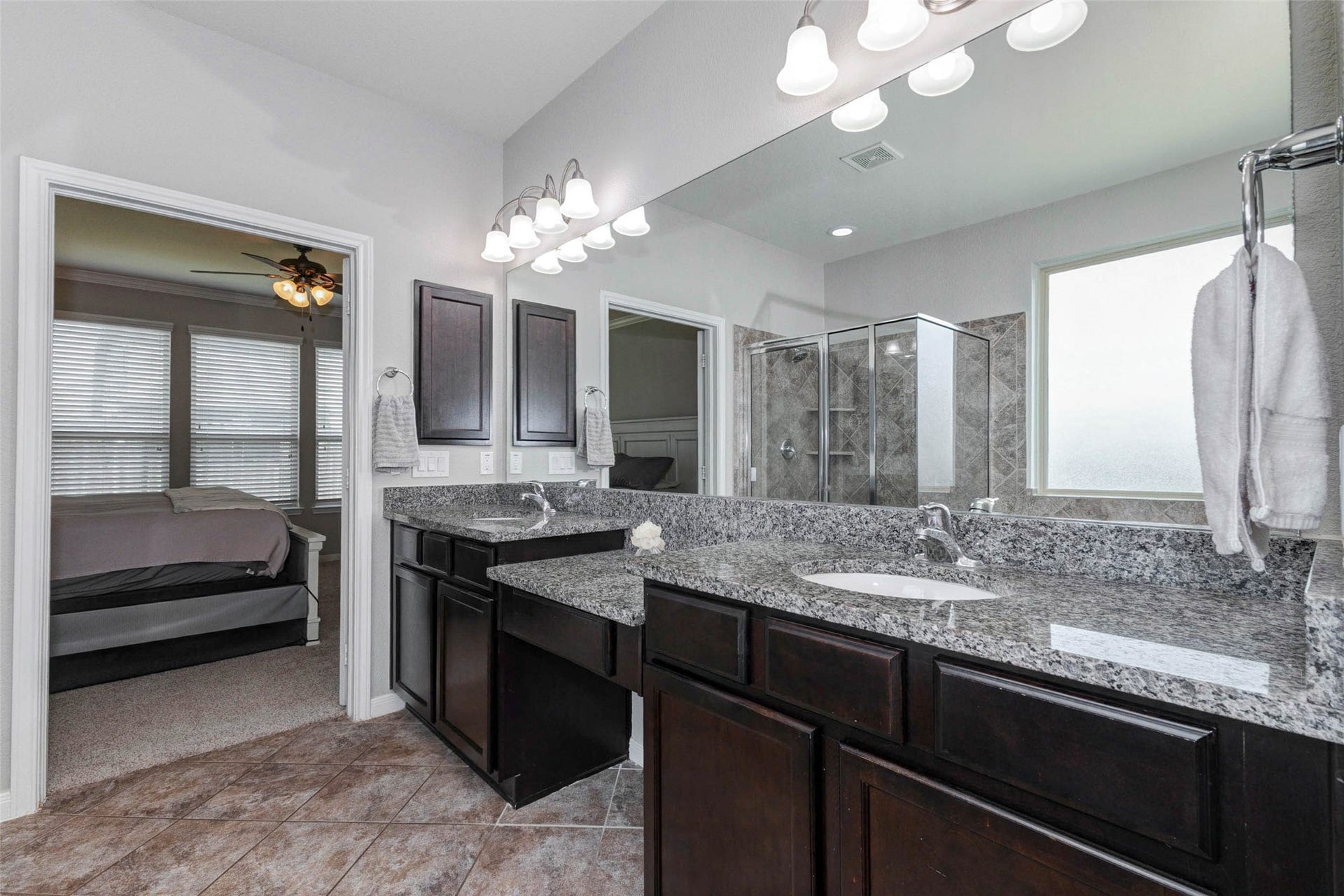 30218 Creekside Drive, Brookshire, TX 77423 Not only will you enjoy having separate sinks, but the vanity will be great for getting ready each morning.