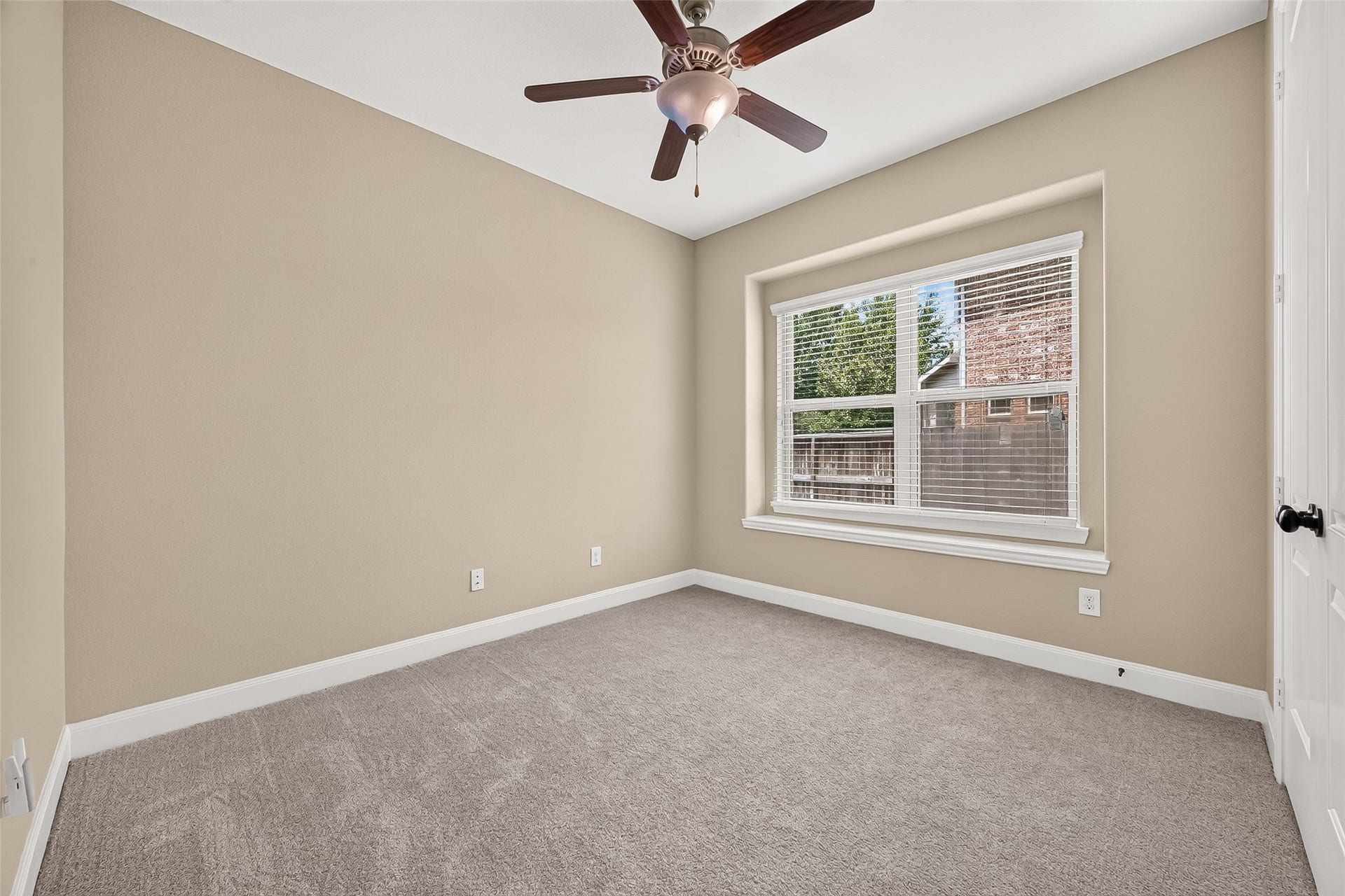 27818 Tamara Branch Lane, Katy, TX 77494 Downstairs Bedroom: A secondary bedroom is conveniently located on the first floor, including a nearby full bathroom with a walk-in shower.