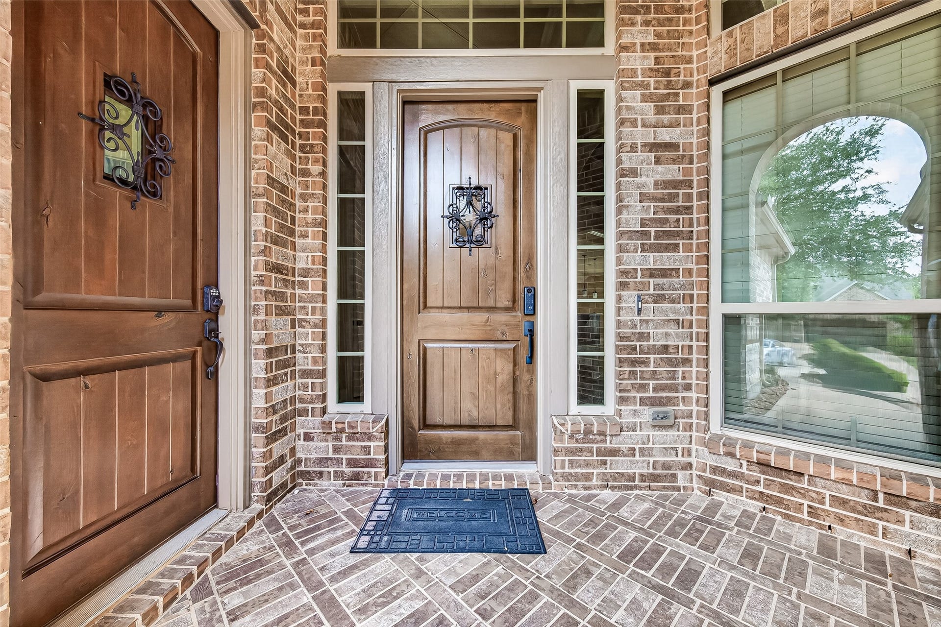 27818 Tamara Branch Lane, Katy, TX 77494 Front Porch: A welcoming front porch with elegant dual wood front doors featuring wrought iron detailing sets the tone for the sophistication found throughout.